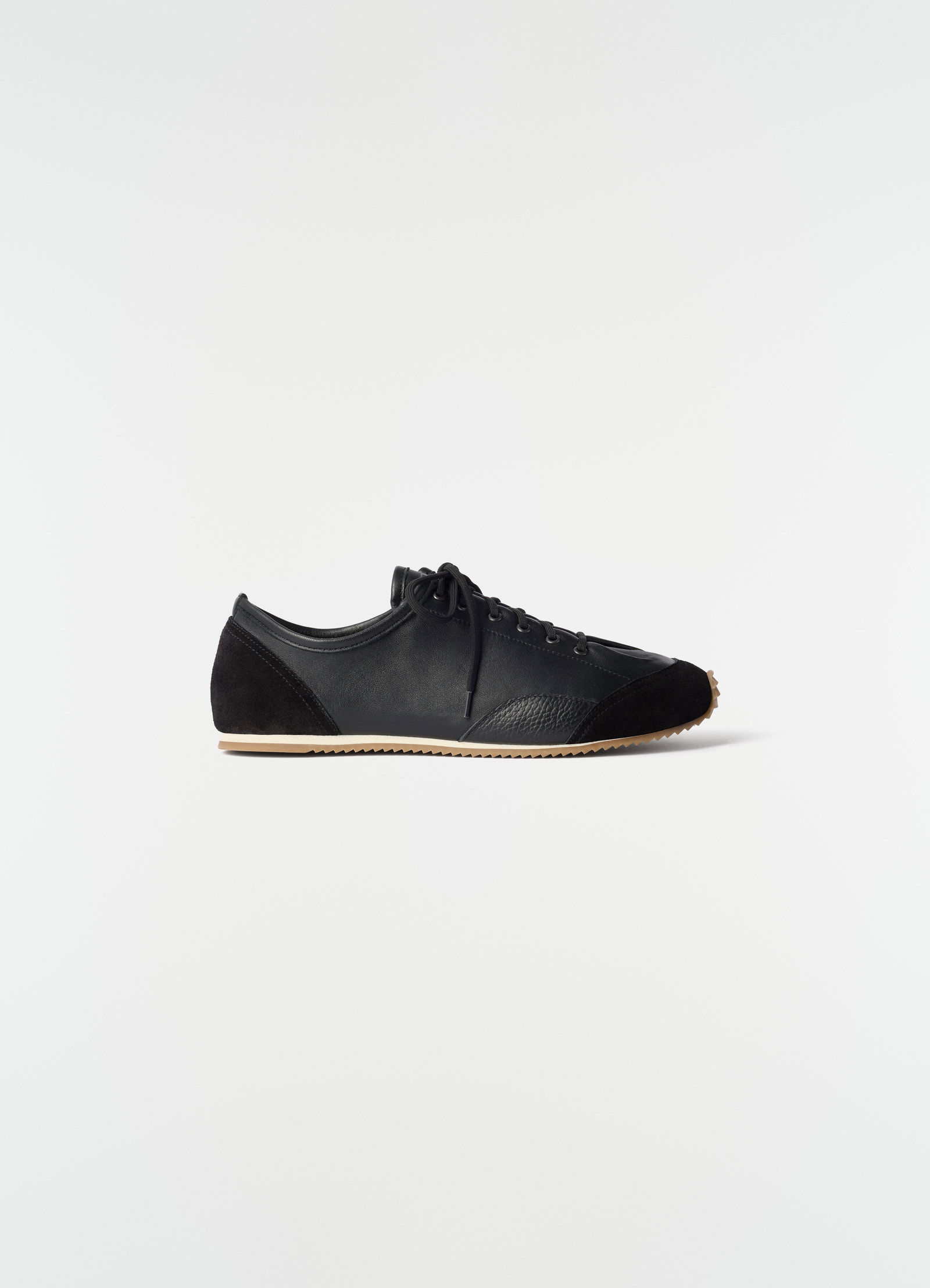 Gummy grips black mixed leather sneakers by lemaire side view on plain white background