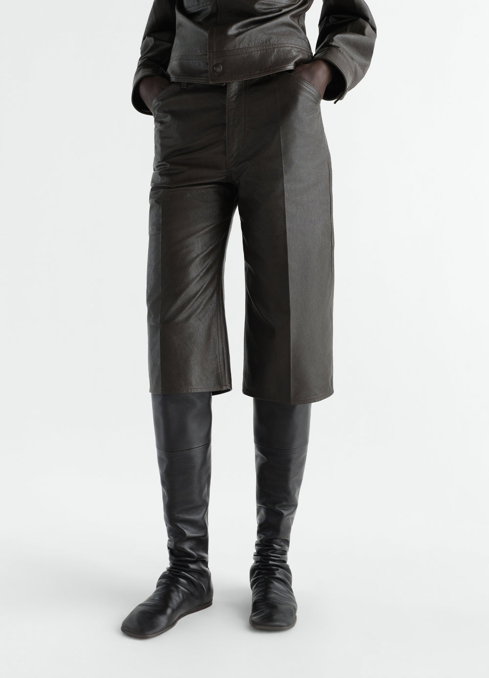 Flat black lambskin boots LEMAIRE worn by model front with wrinkled detailing and square toe