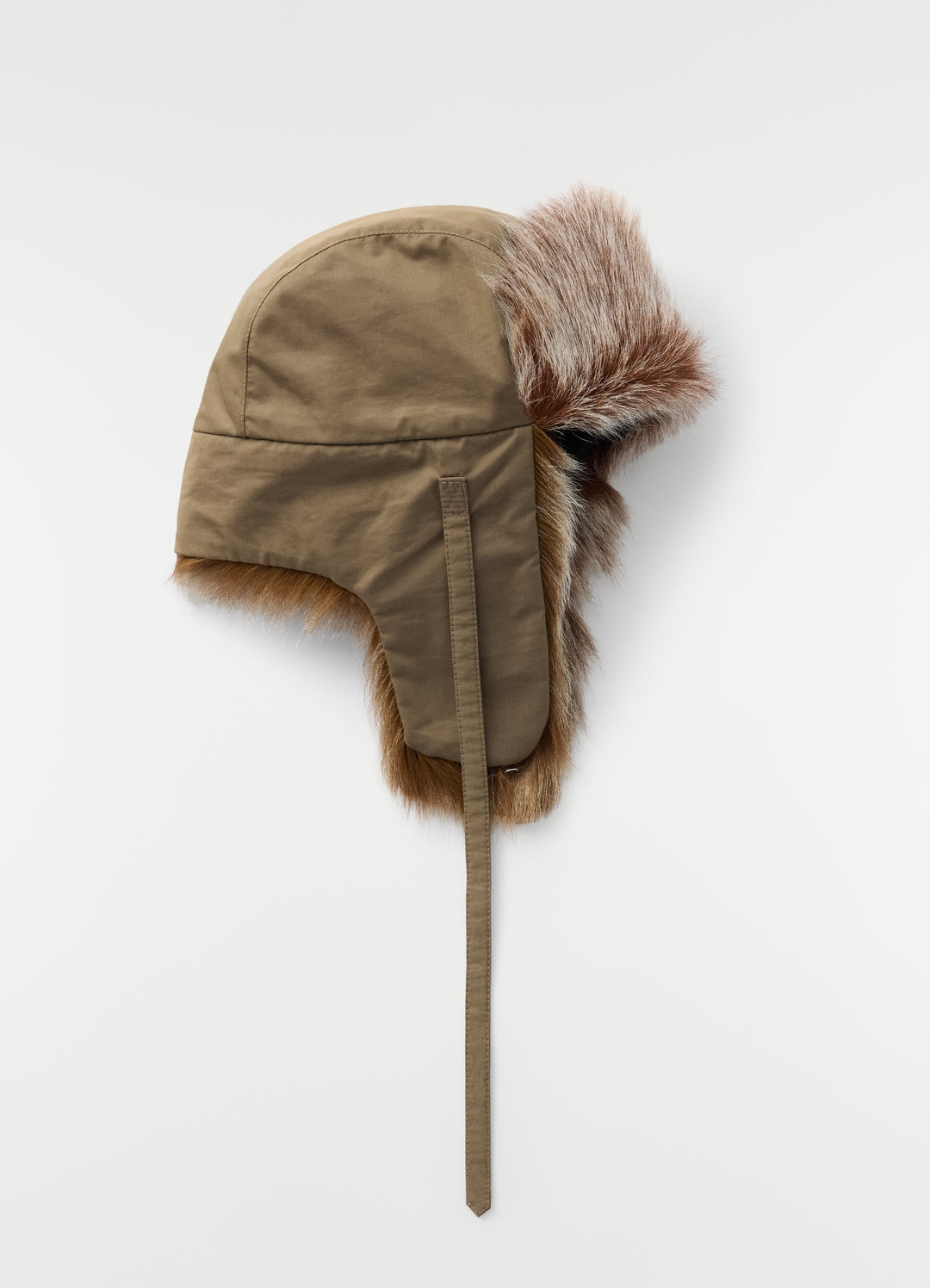 Fuzzy beige chapka with long-hair goat leather trim by LEMAIRE on plain white background