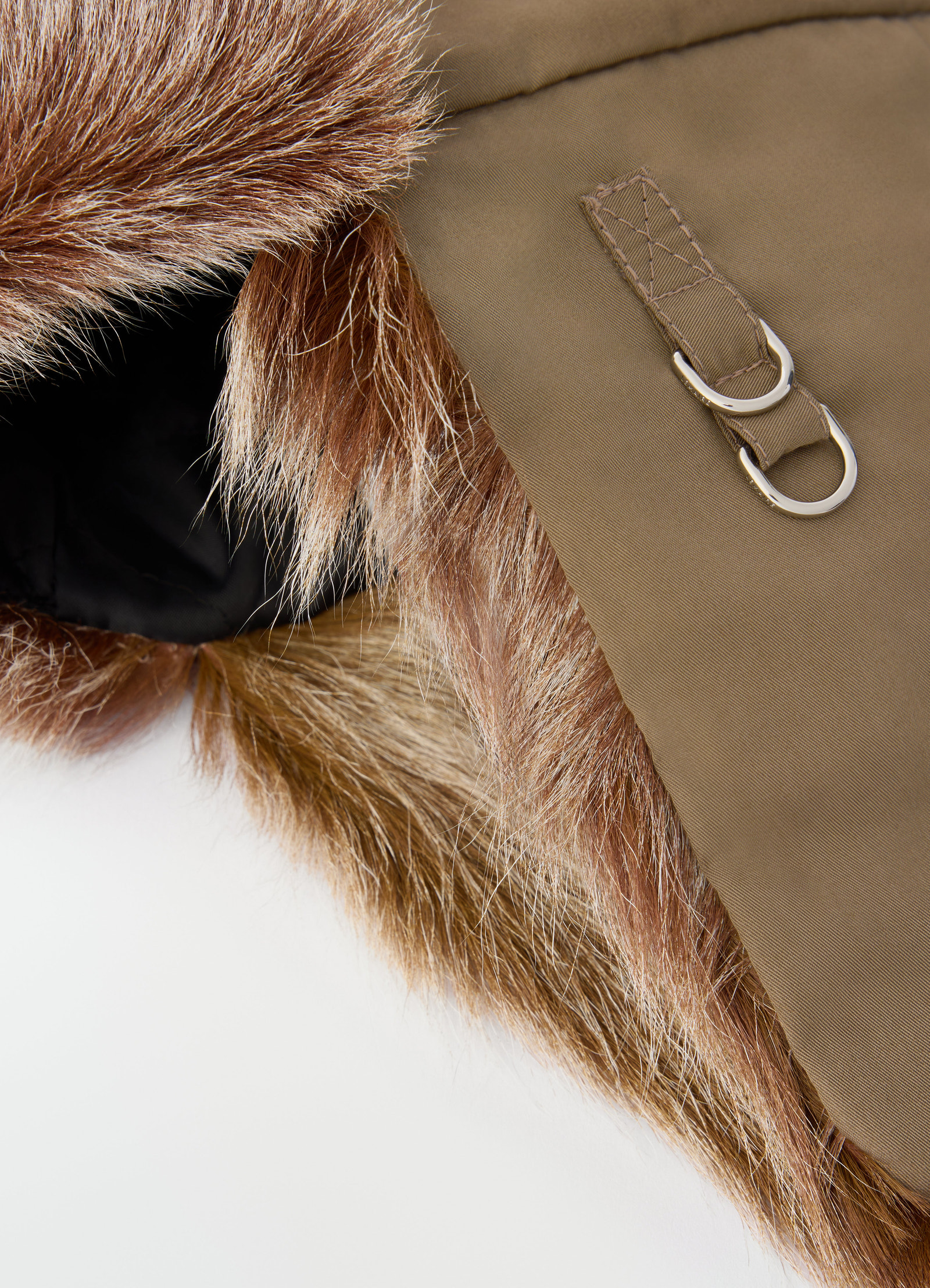 Fuzzy long-hair goat leather chapka in brown with metal rings by lemaire close-up detail