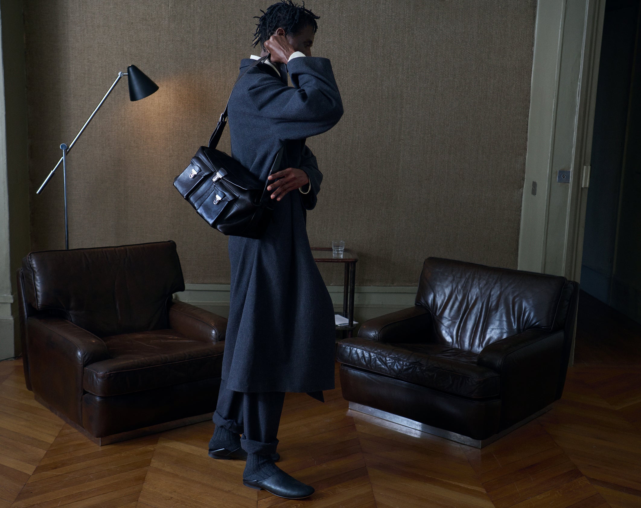 Wool coat in Dark gray wool, model shot, Side view Oversized design