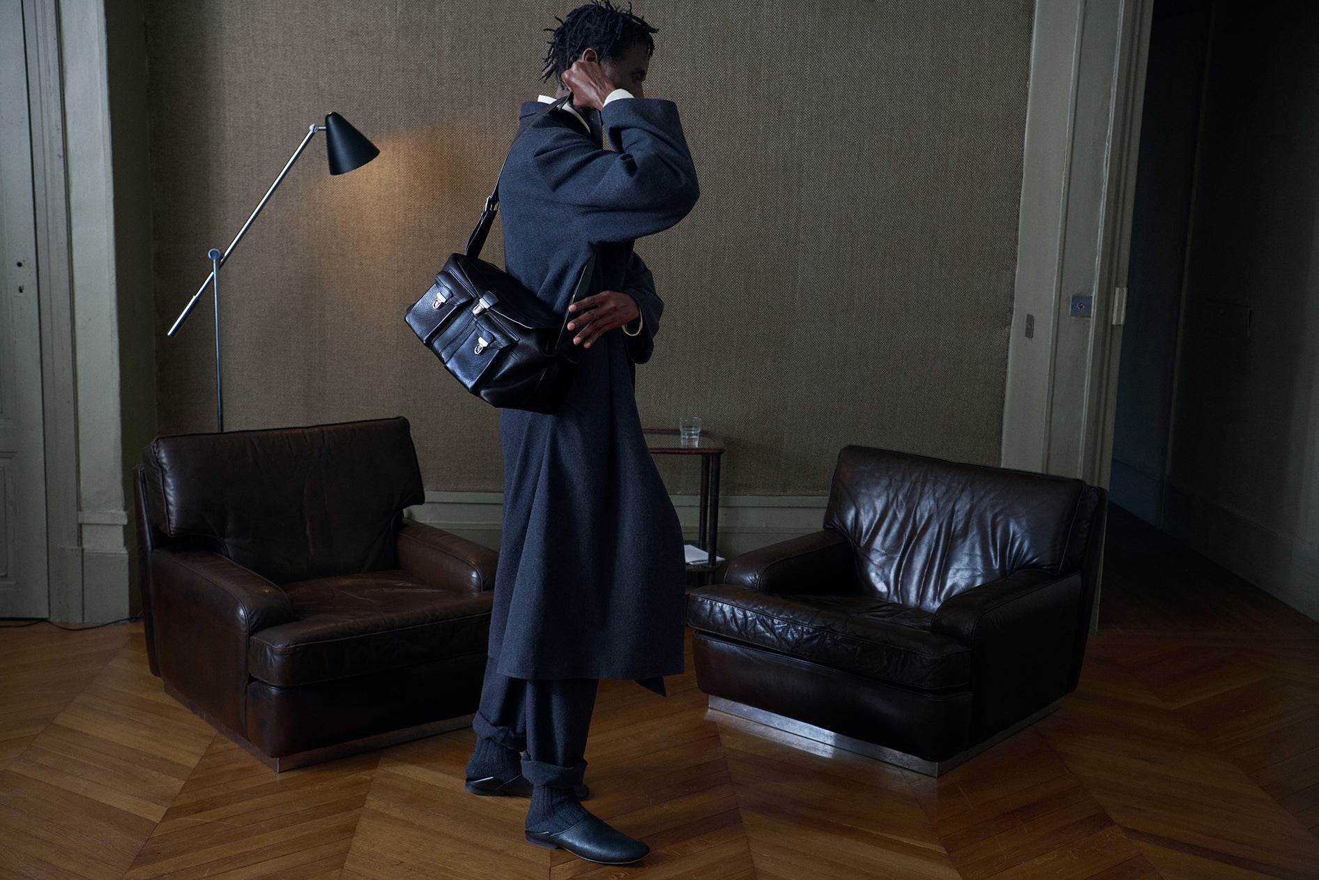 Wool coat in Dark gray wool, model shot, Side view Loose fit