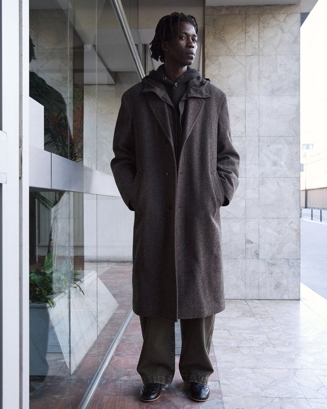 Brown coat in Brown wool, model shot, Front view Long and fitted