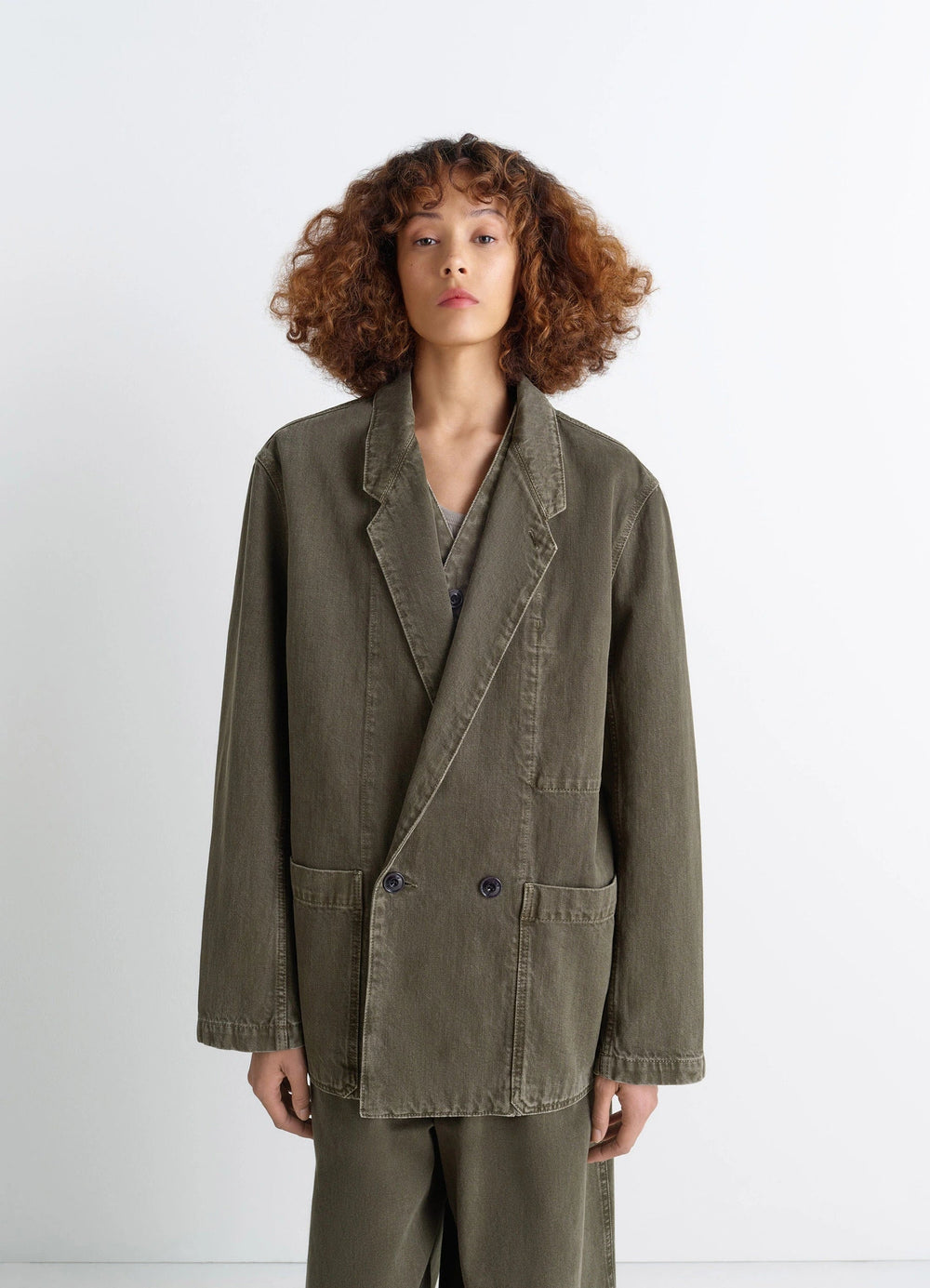 Lemaire Workwear Blazer in Garment Dyed Snow Denim, model shot, front view oversized fit
