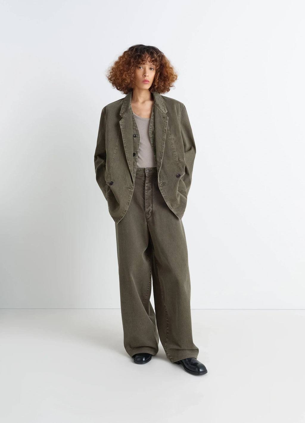 Lemaire Workwear Blazer in Garment Dyed Snow Denim, model shot, three-quarter view loose tailoring