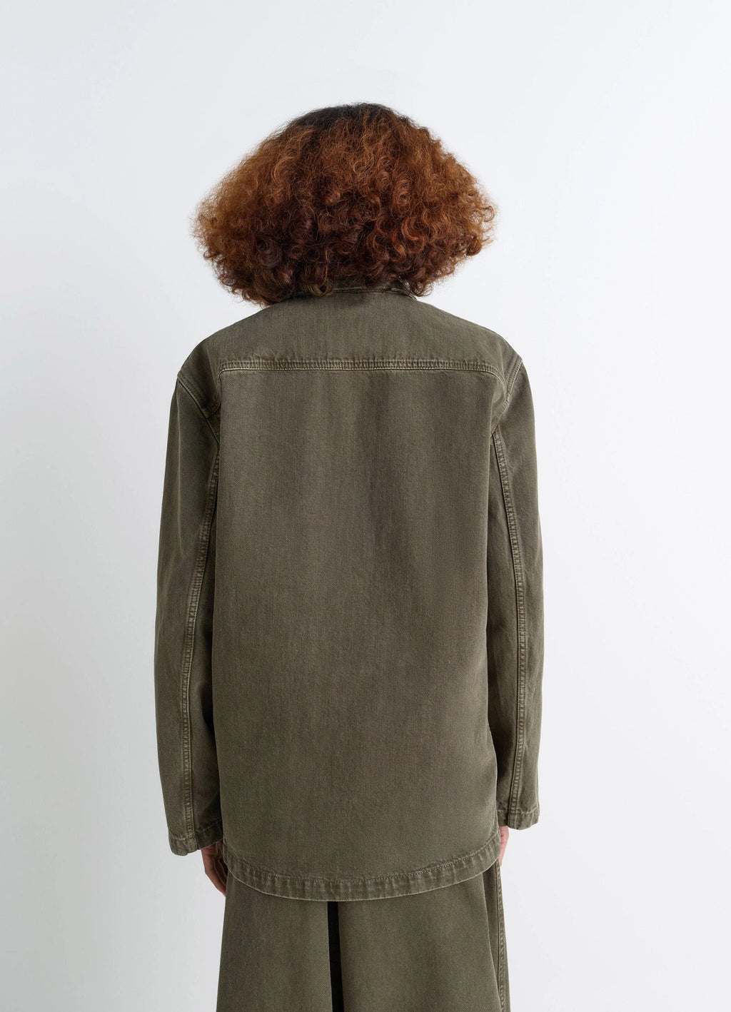 Lemaire Workwear Blazer in Garment Dyed Snow Denim, model shot, back view straight back seam