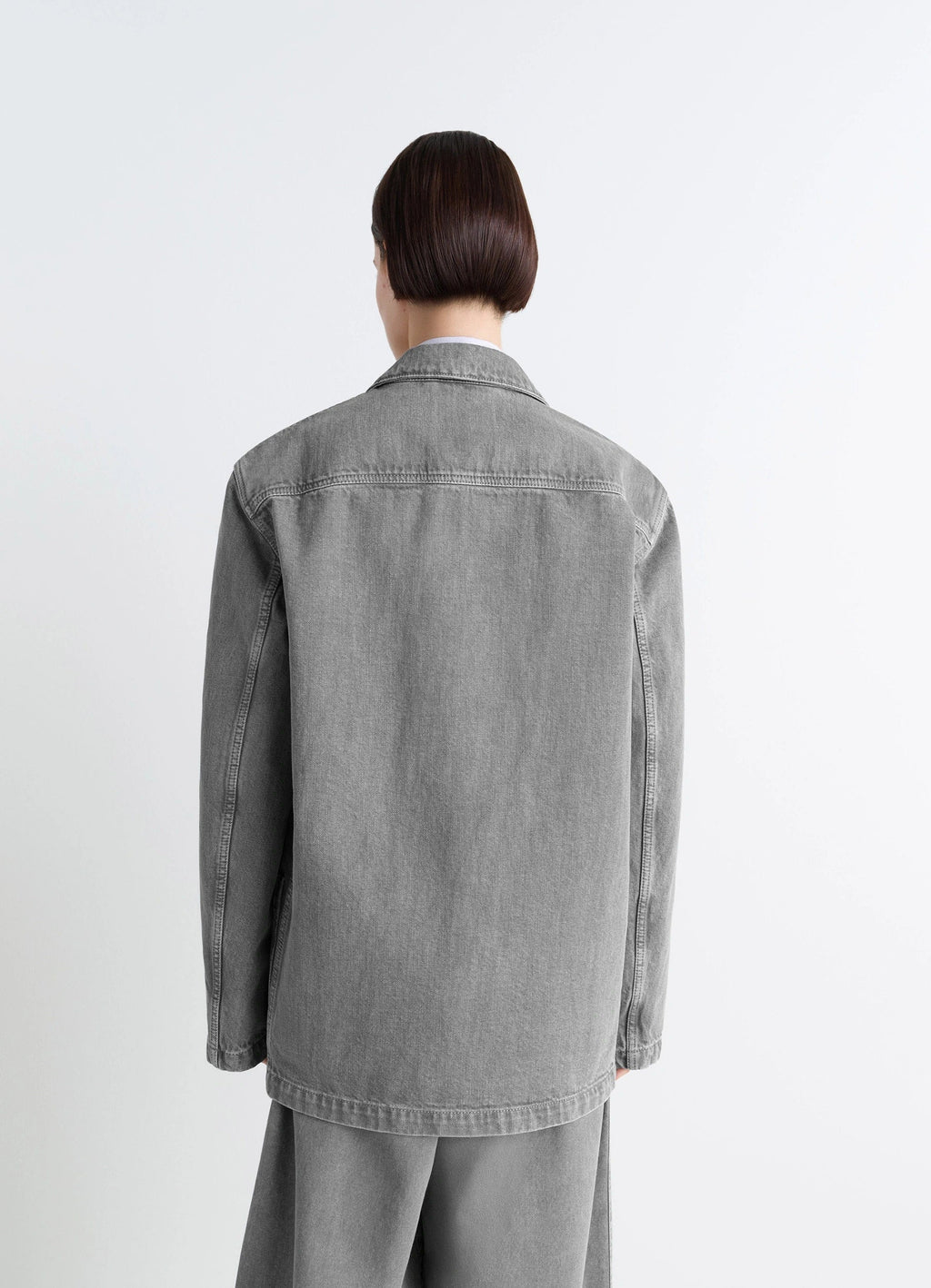 Lemaire Workwear Blazer in Garment Dyed Snow Denim, model shot, back view relaxed fit