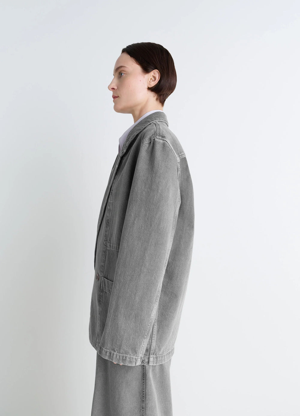 Lemaire Workwear Blazer in Garment Dyed Snow Denim, model shot, side profile view oversized cut