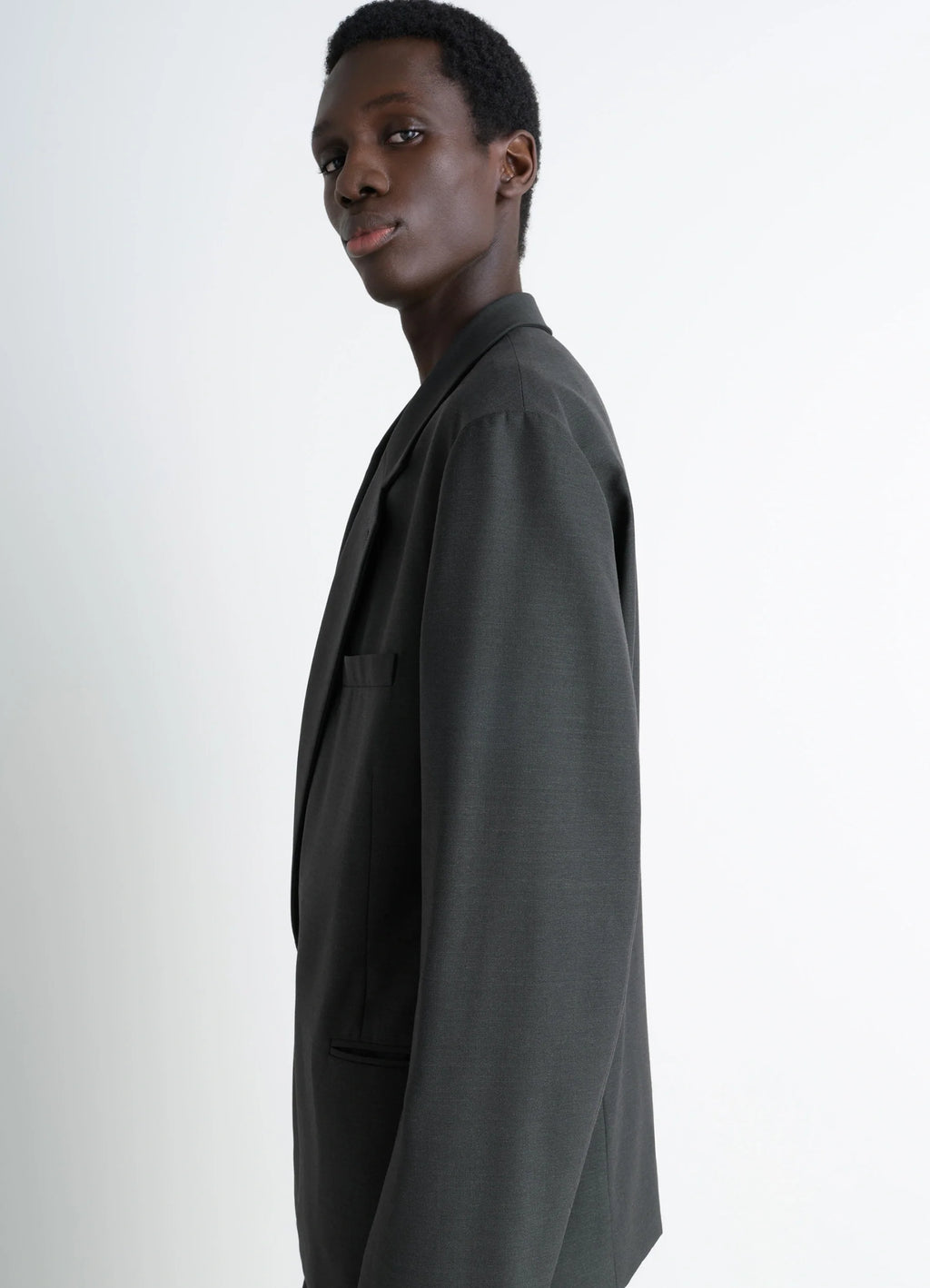 SOFT DOUBLE BREASTED JACKET in Mottled Tropical Wool-Blend, model shot, side view supple and deconstructed