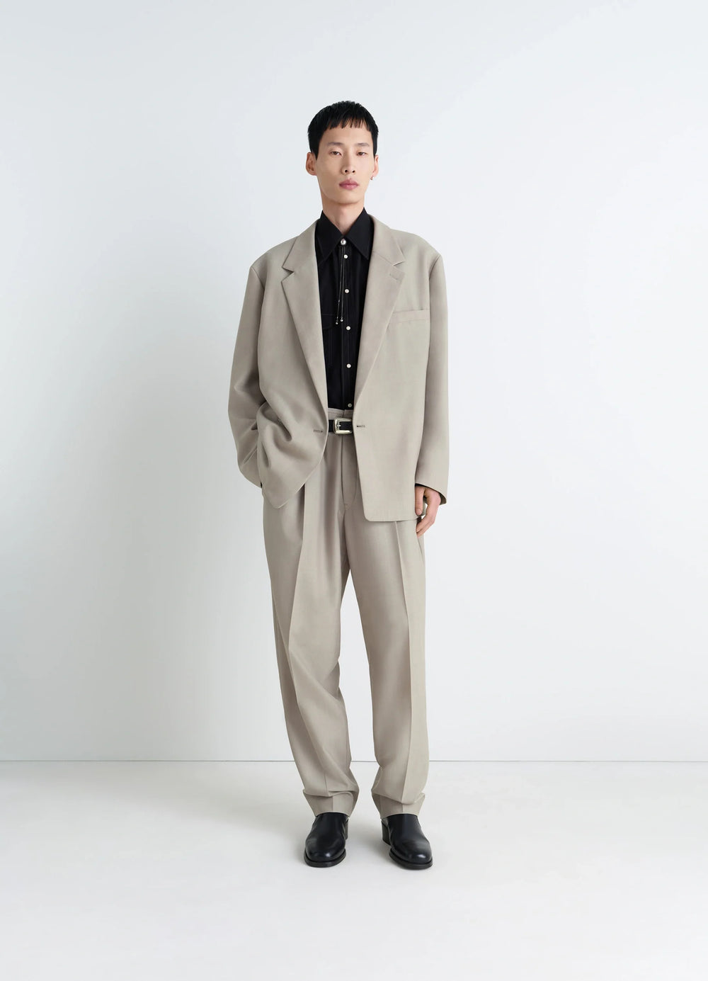 Soft Double Breasted Jacket in Mottled Tropical Wool-Blend, model shot, three-quarter view relaxed fit, unstructured