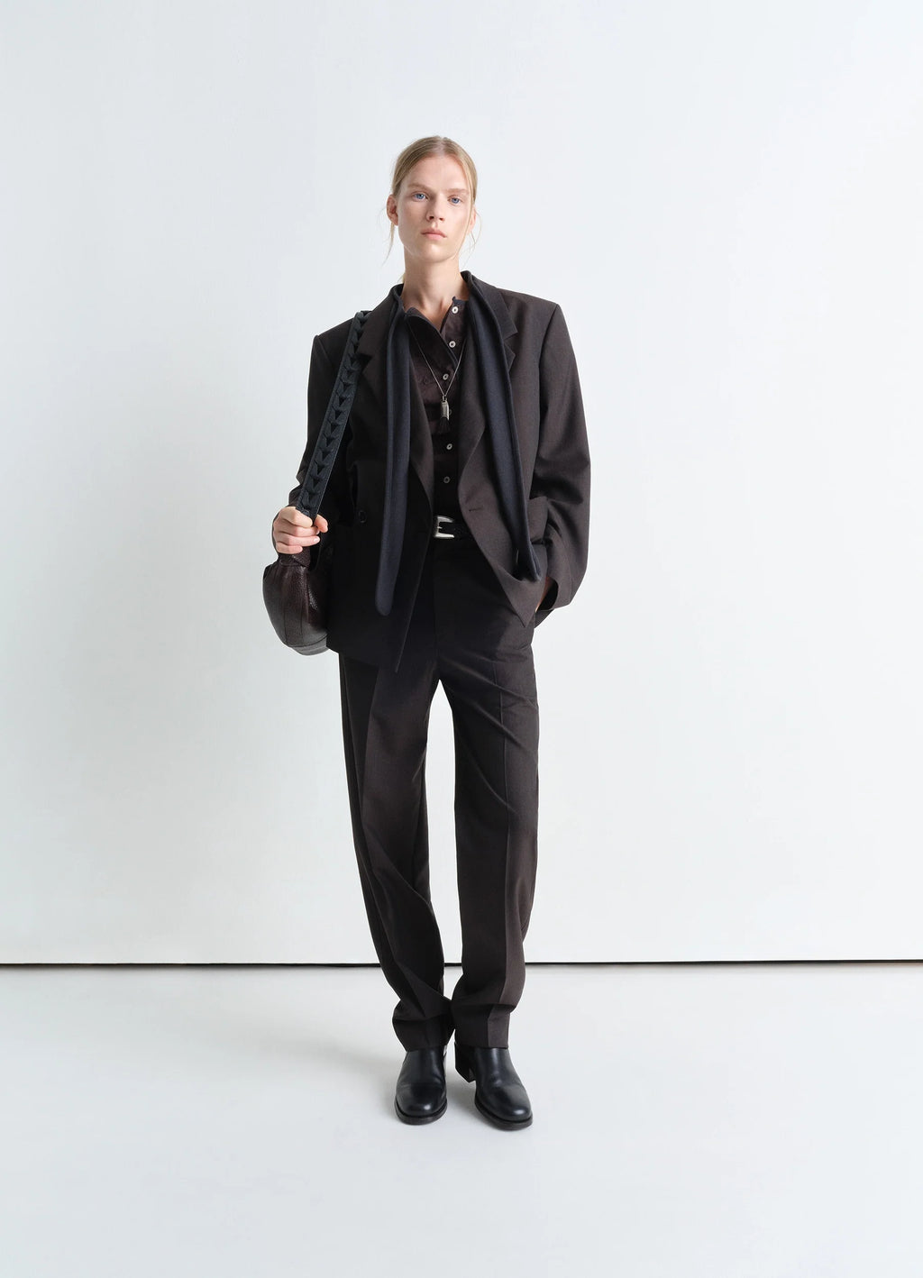 Lemaire Double Breasted Tailored Ja in Tropical Poly-Wool Mélange Twill, model shot, model front angled relaxed fit pocket de