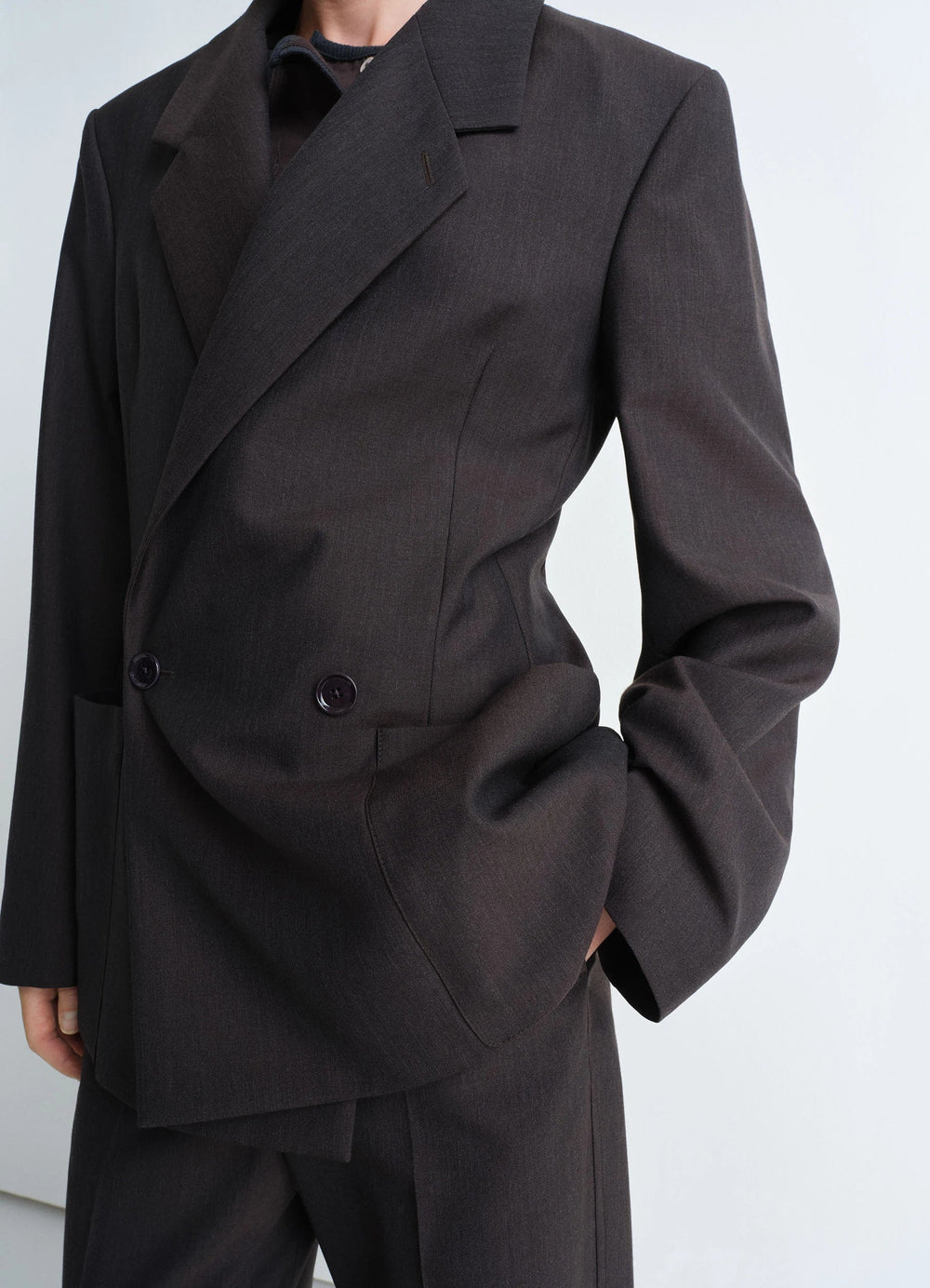 Lemaire Double Breasted Tailored Ja in Tropical Poly-Wool Mélange Twill, model shot, midsection angled vi angled darts, tailo