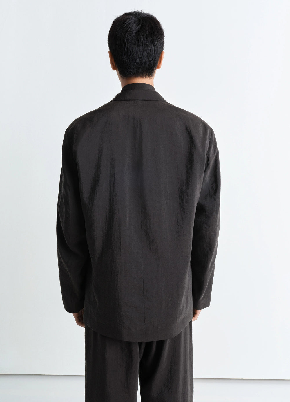 Lemaire Soft Double-Breasted Jacket in Dry Silk, model shot, back view straight hem