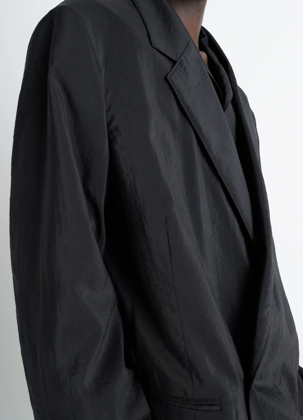 Lemaire Soft Double Breasted Jacket in Black Dry Silk Blend, model shot, close-up detail shot soft crinkled texture