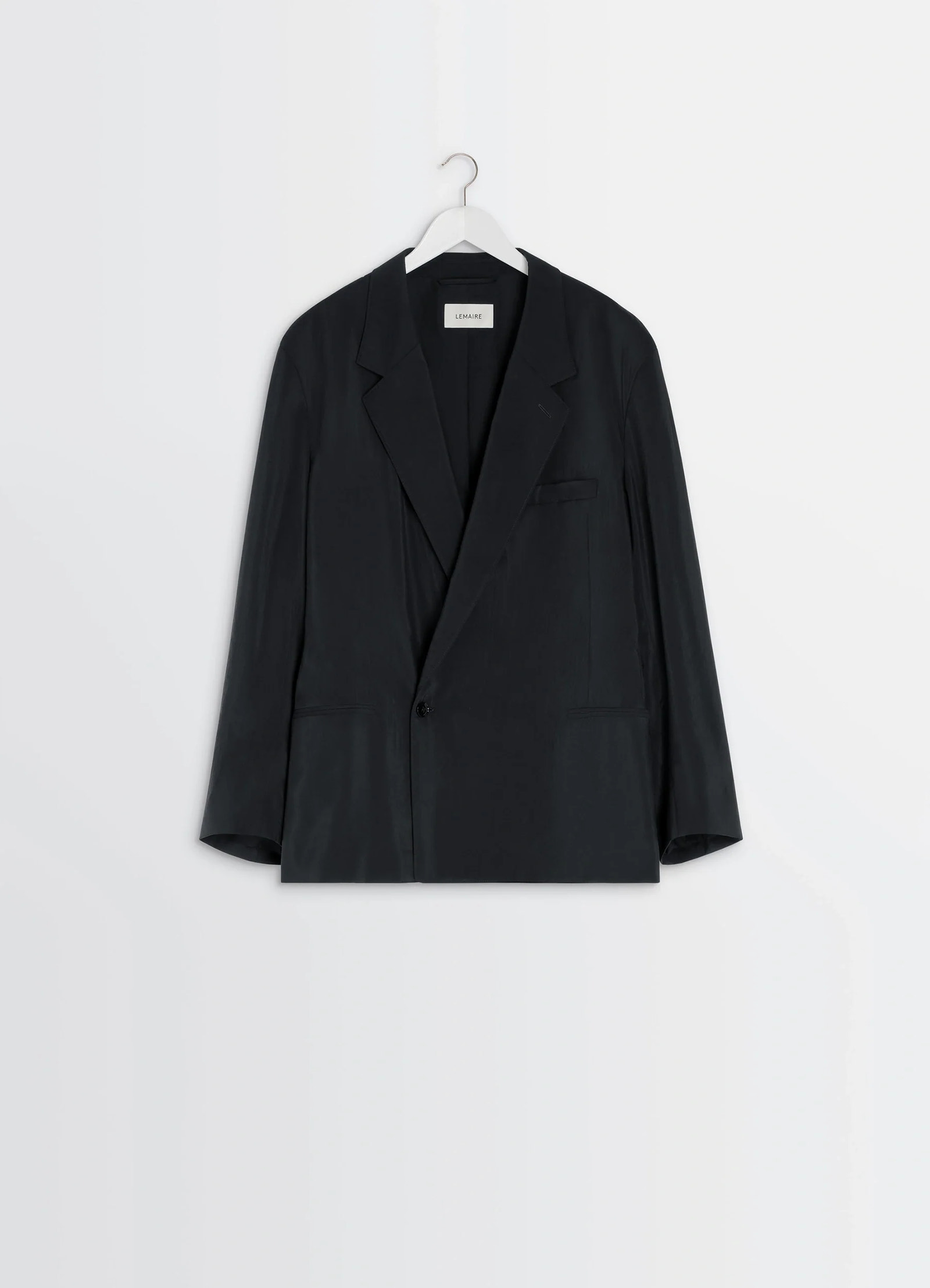 Lemaire soft double breasted jacket in black dry silk blend, product shot, hanger display front single button closure