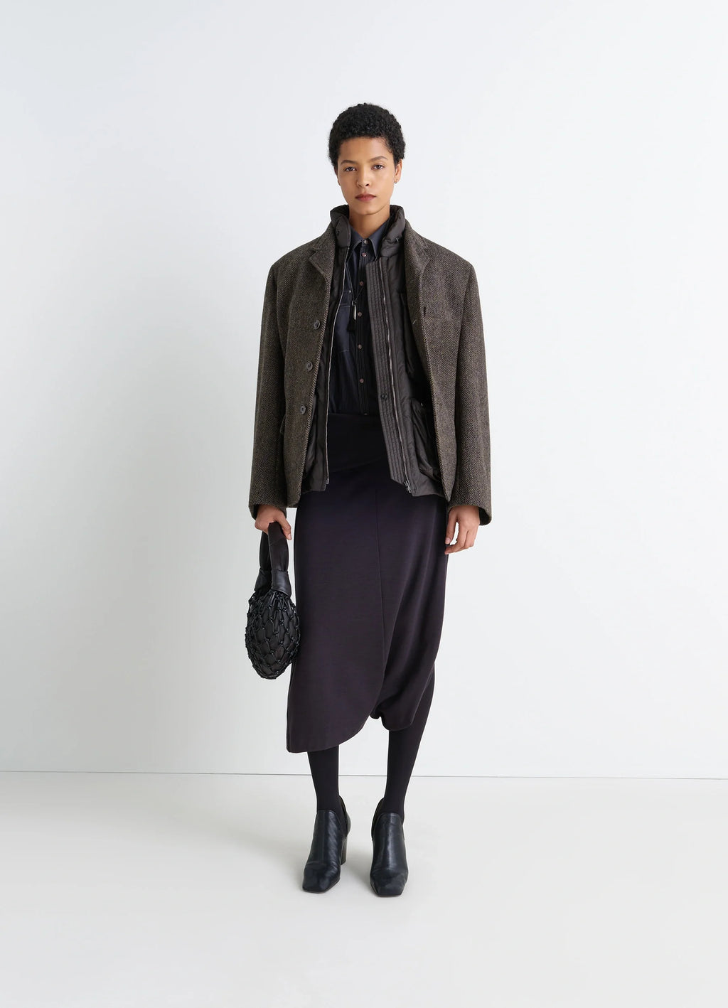 Boxy Tailored Jacket in Harris Tweed Herringbone, model shot, 3/4 front view layered look with skirt