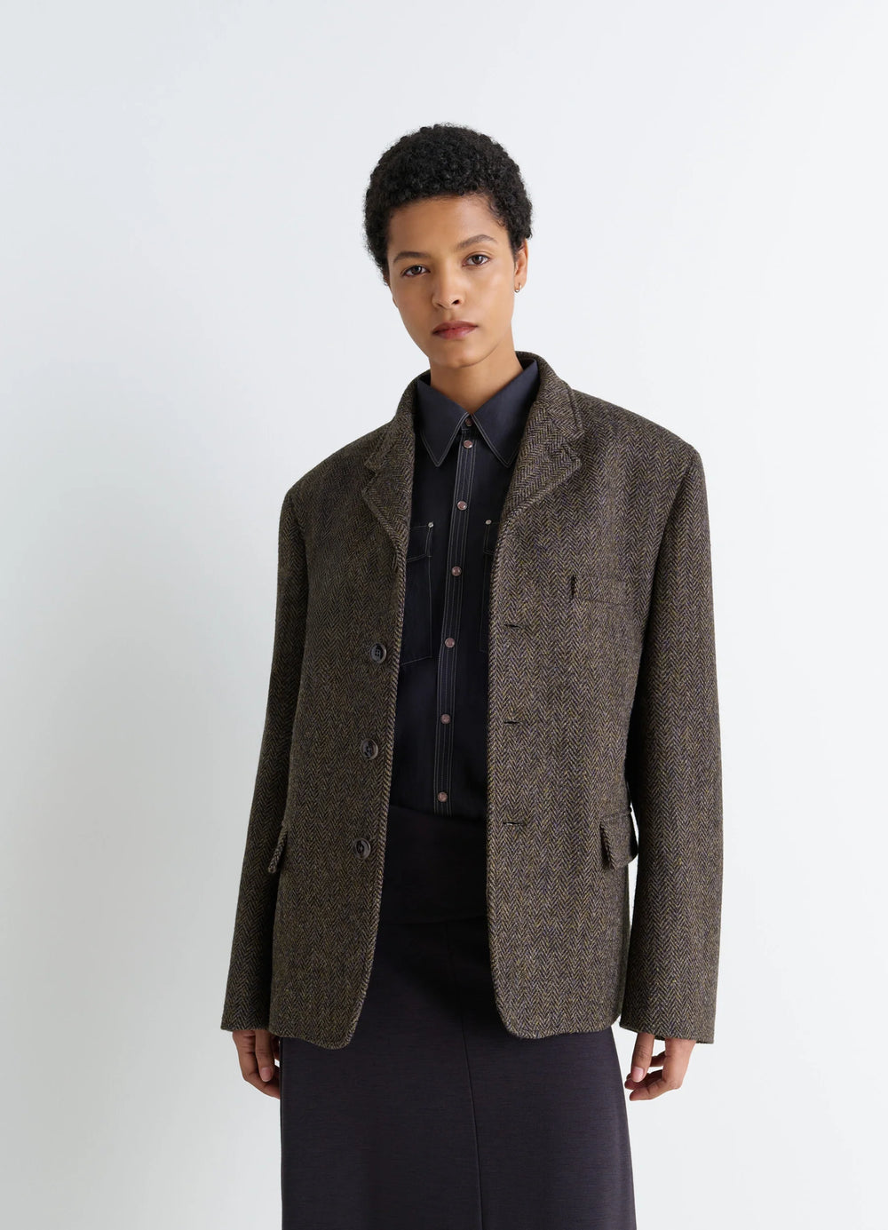 Boxy Tailored Jacket in Harris Tweed Herringbone, model shot, side view layered look with shirt