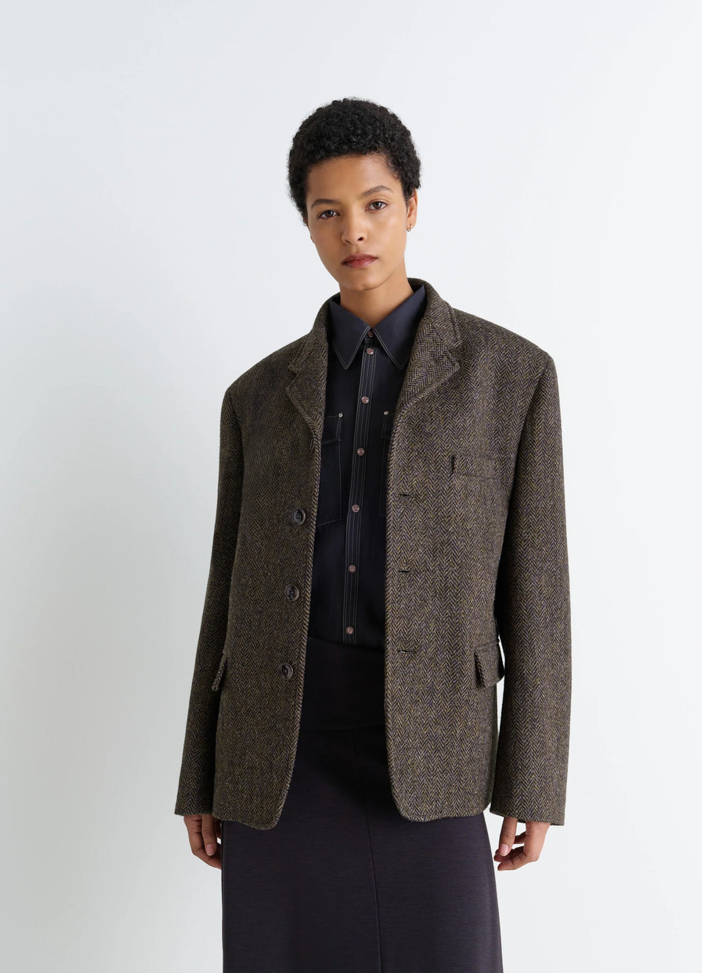 Boxy Tailored Jacket in Harris Tweed Herringbone, model shot, side view layered look with shirt