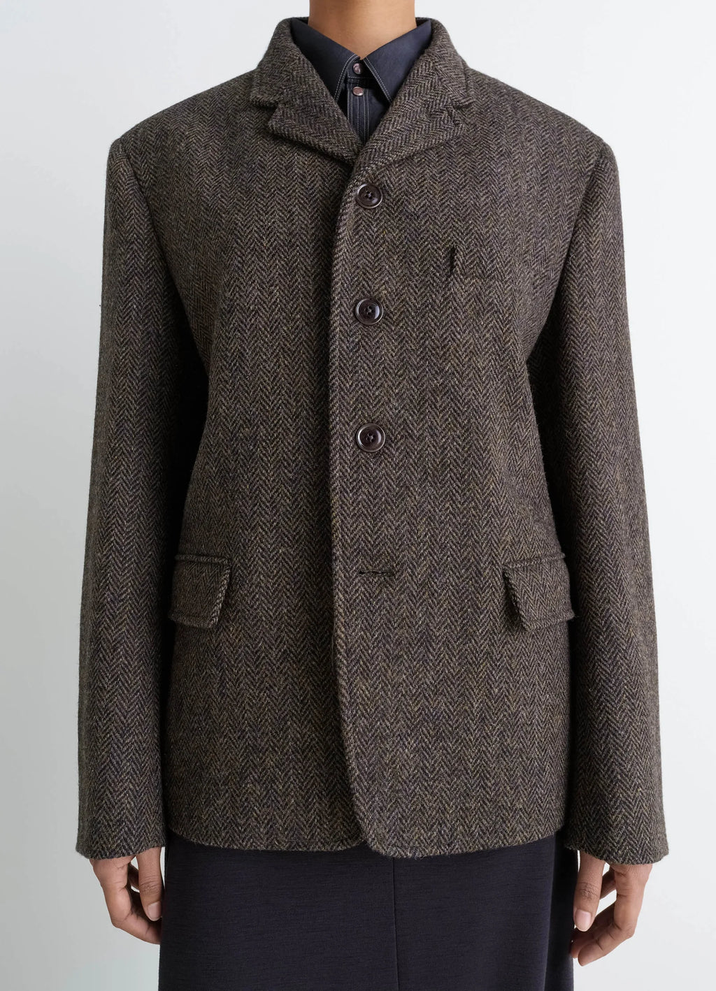 Boxy Tailored Jacket in Harris Tweed Herringbone, model shot, close-up front button detail, tweed texture