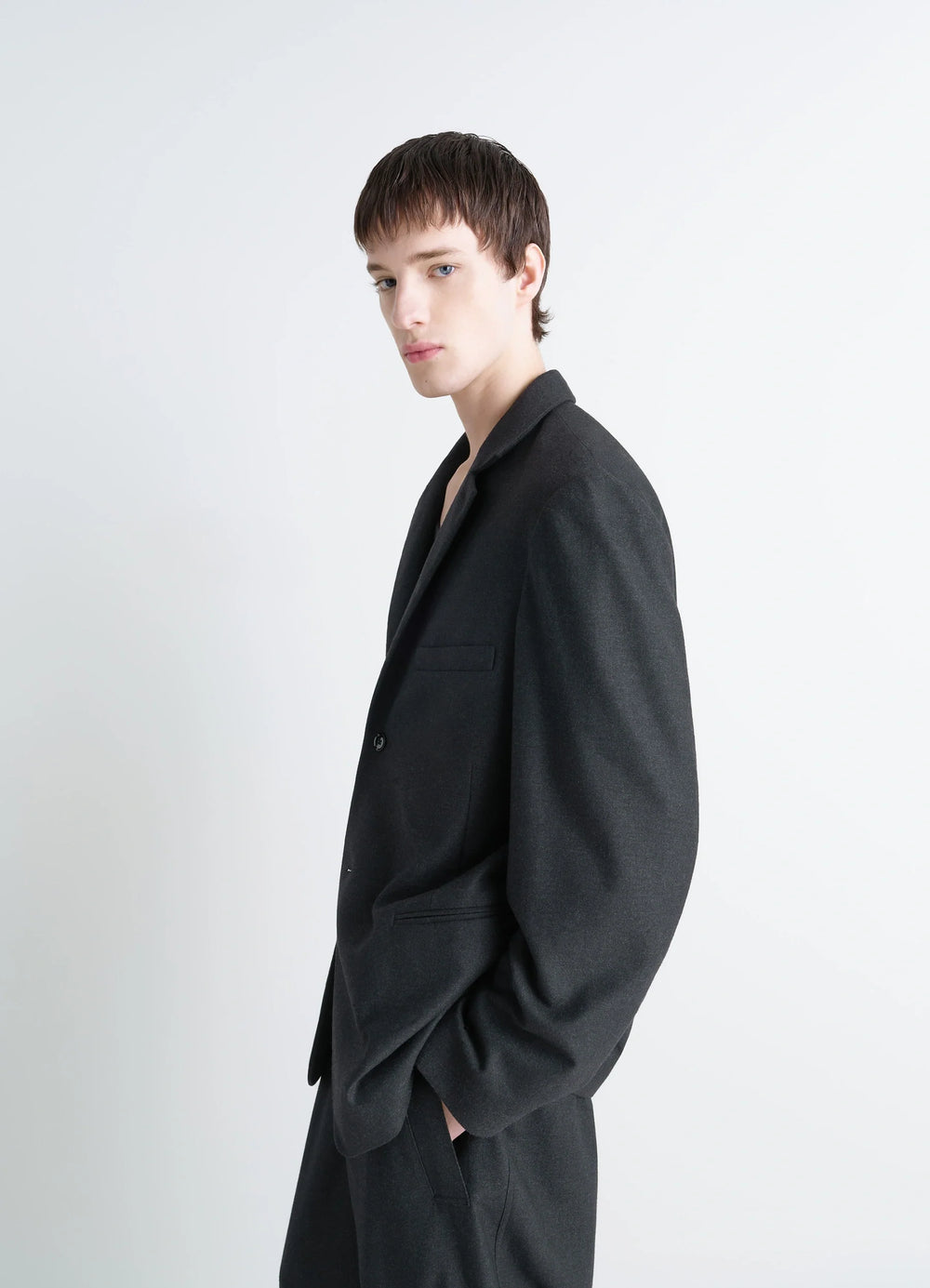 Lemaire Soft Single Breasted Jacket in Lightweight Cashmere-Blend, model shot, side profile view slightly padded shoulders