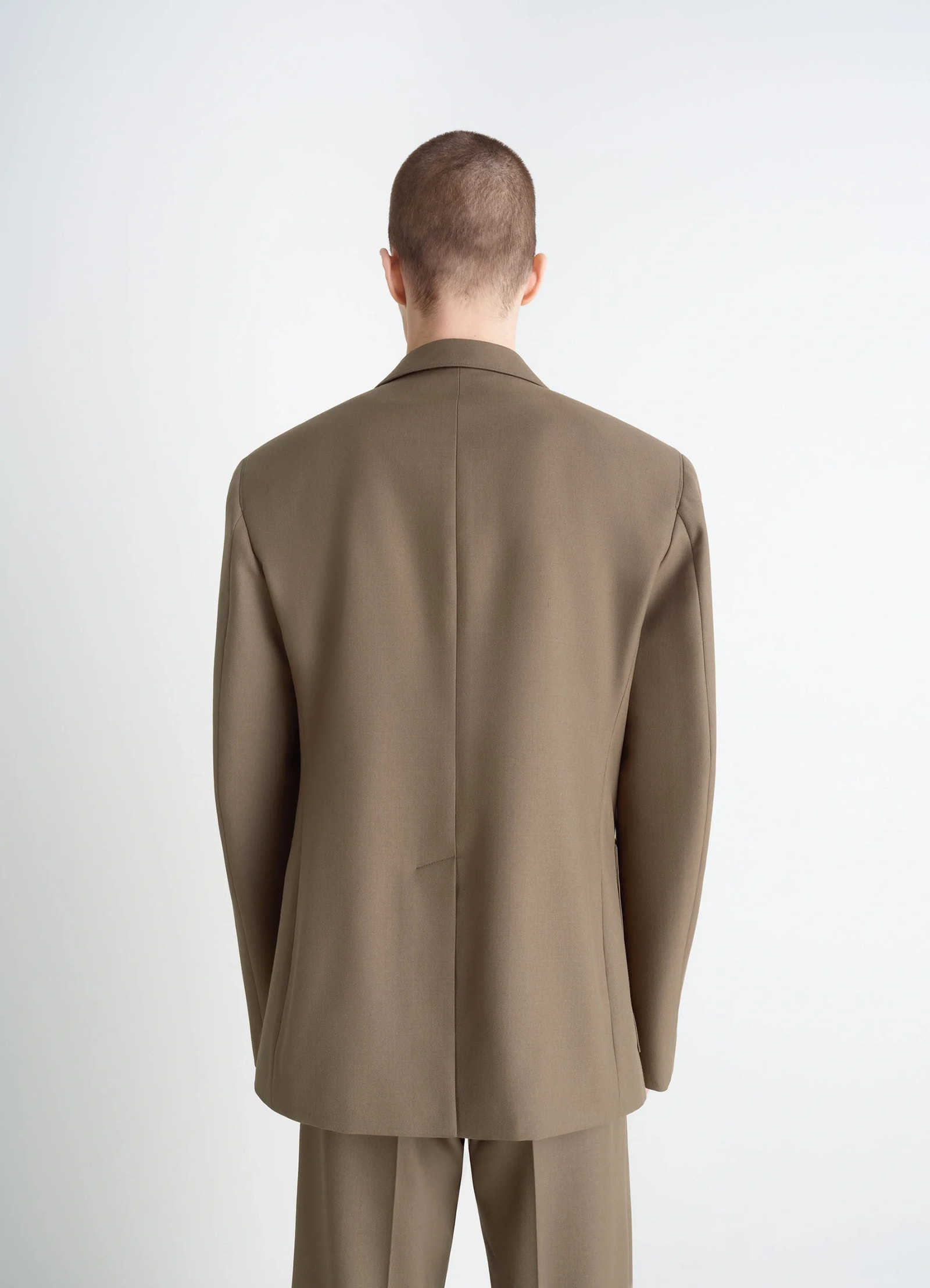 Tailored single breasted jacket in wool-blend in taupe, model shot, back view smooth back seam