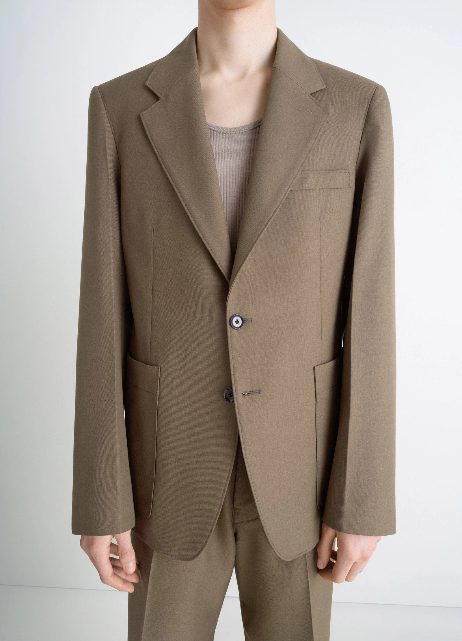 Tailored single breasted jacket in wool-blend in taupe, model shot, close-up torso view two-button closure