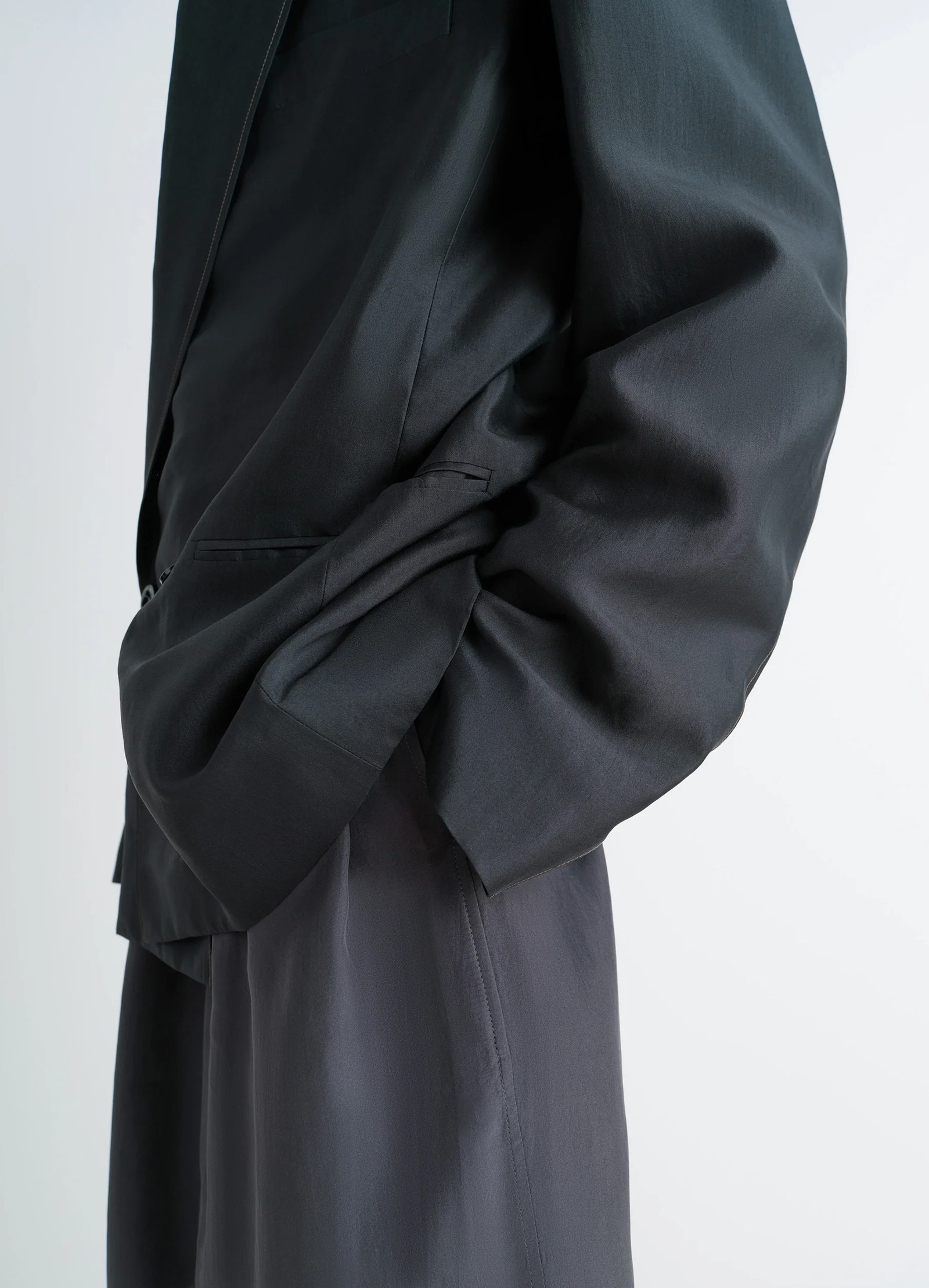 Soft jacket in shiny silk, model shot, side view ruched sleeve detail
