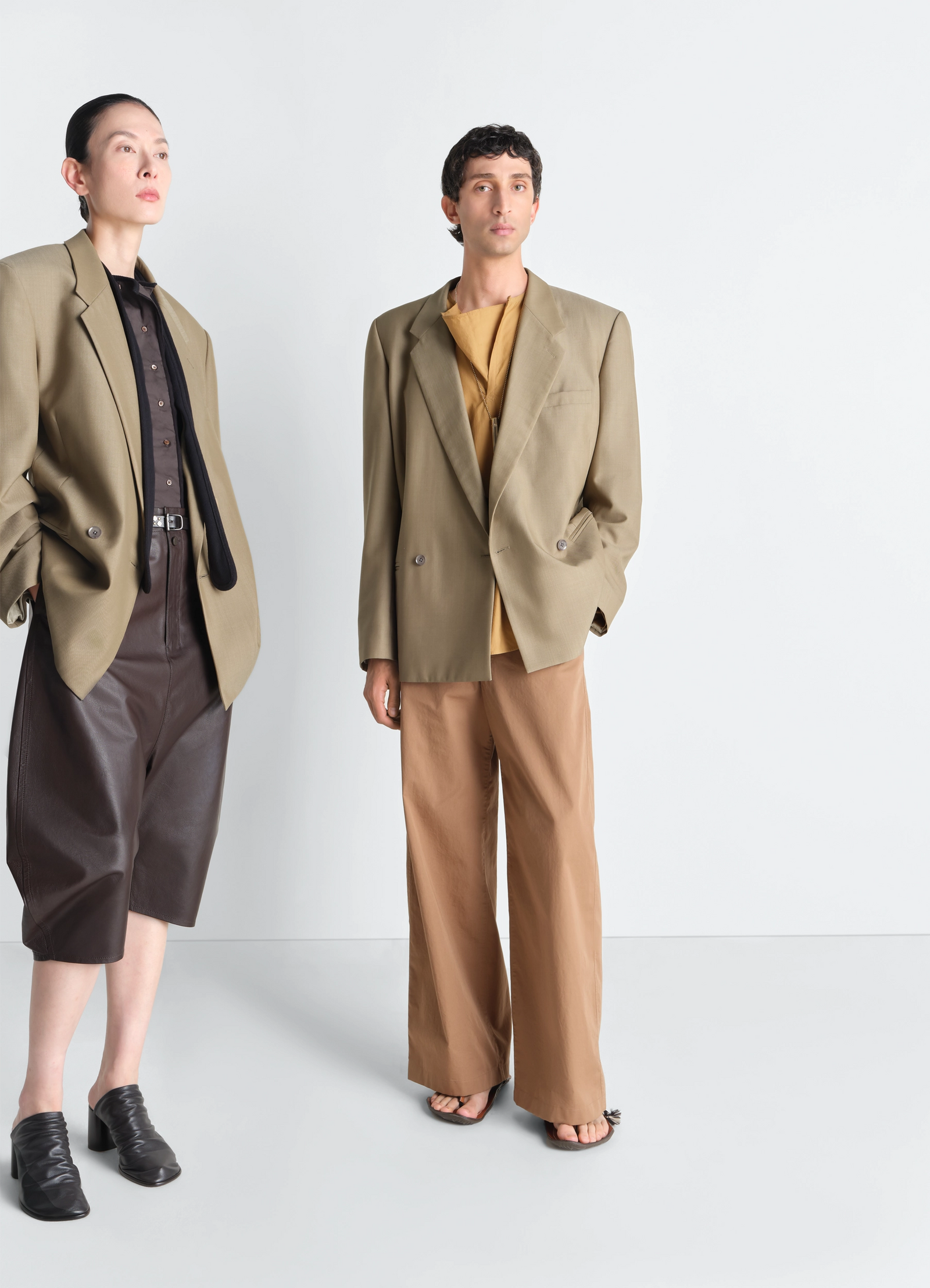 Double breasted tailored jacket in tropical polywool, model shot, front view slightly fitted silhouette