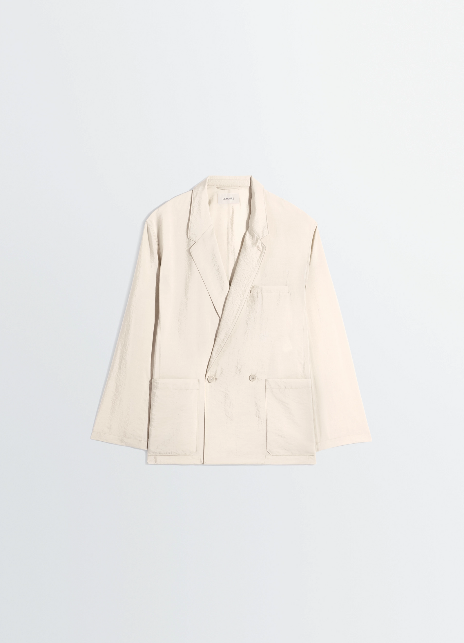 Soft double breasted jacket in dry silk, product shot, overhead view boxy structure