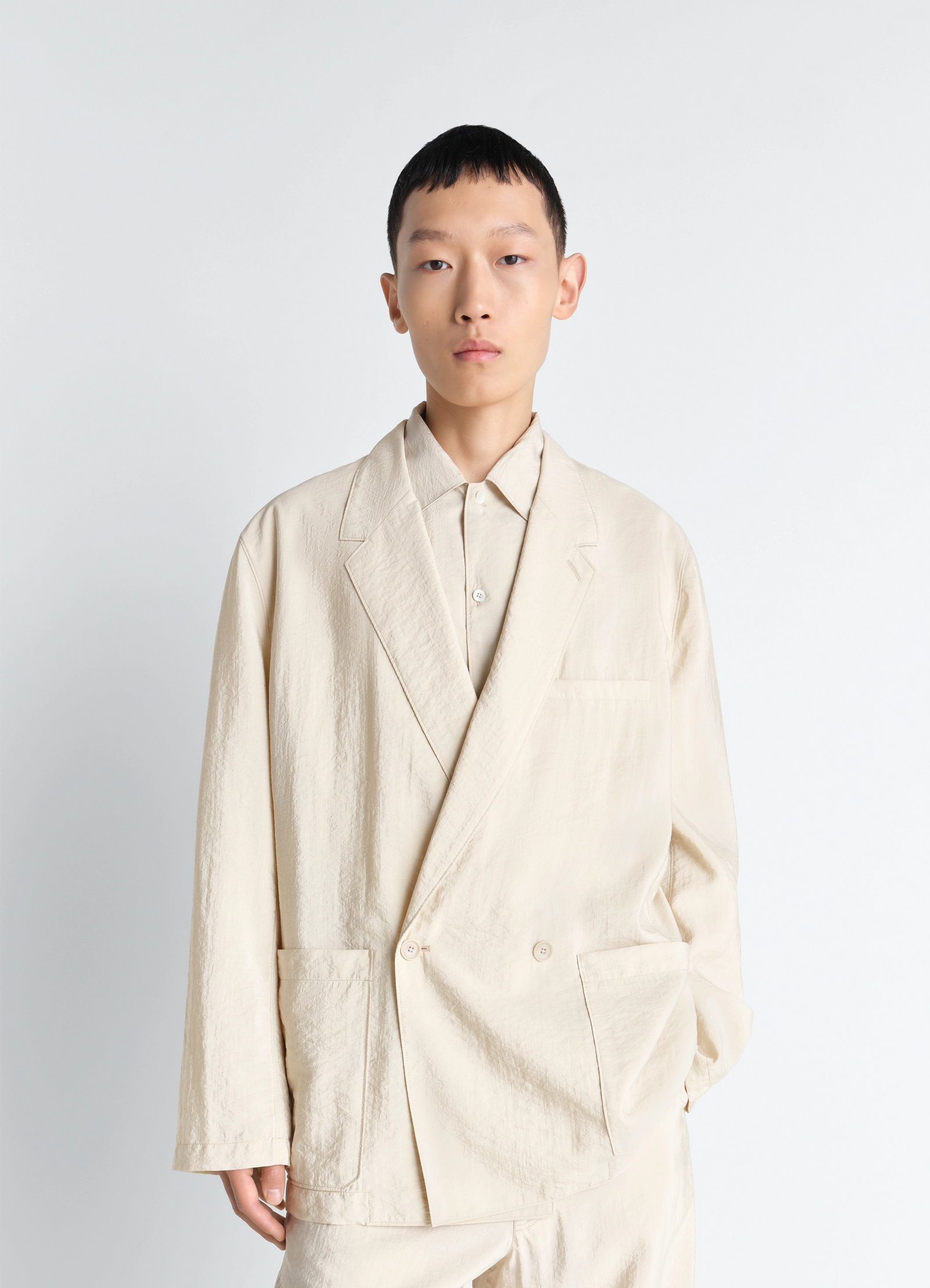 Soft double breasted jacket in dry silk, model shot, front view tailored fit