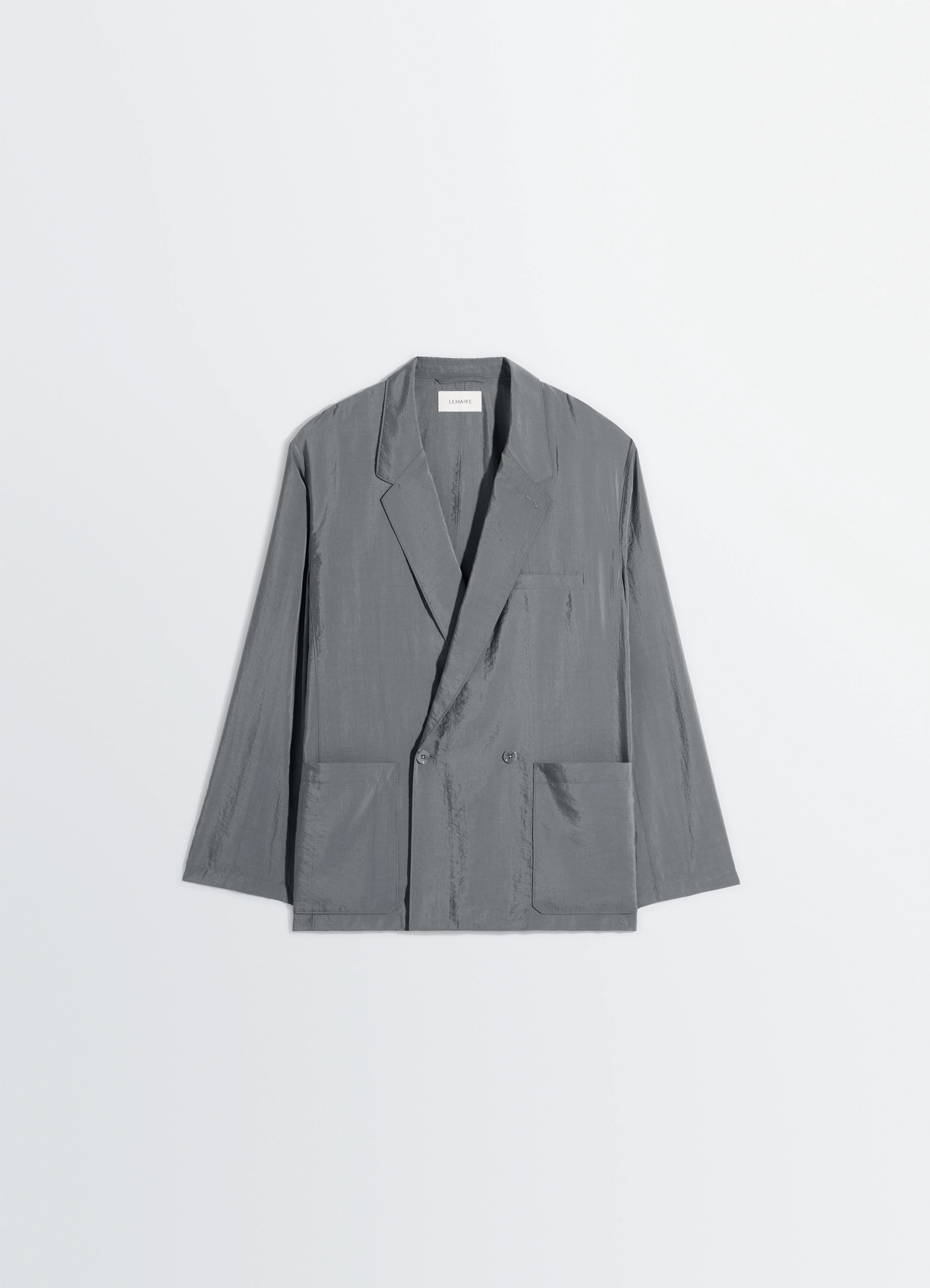 Soft double breasted jacket in dry silk, product shot, angled overhead view buttoned front, pocket detail