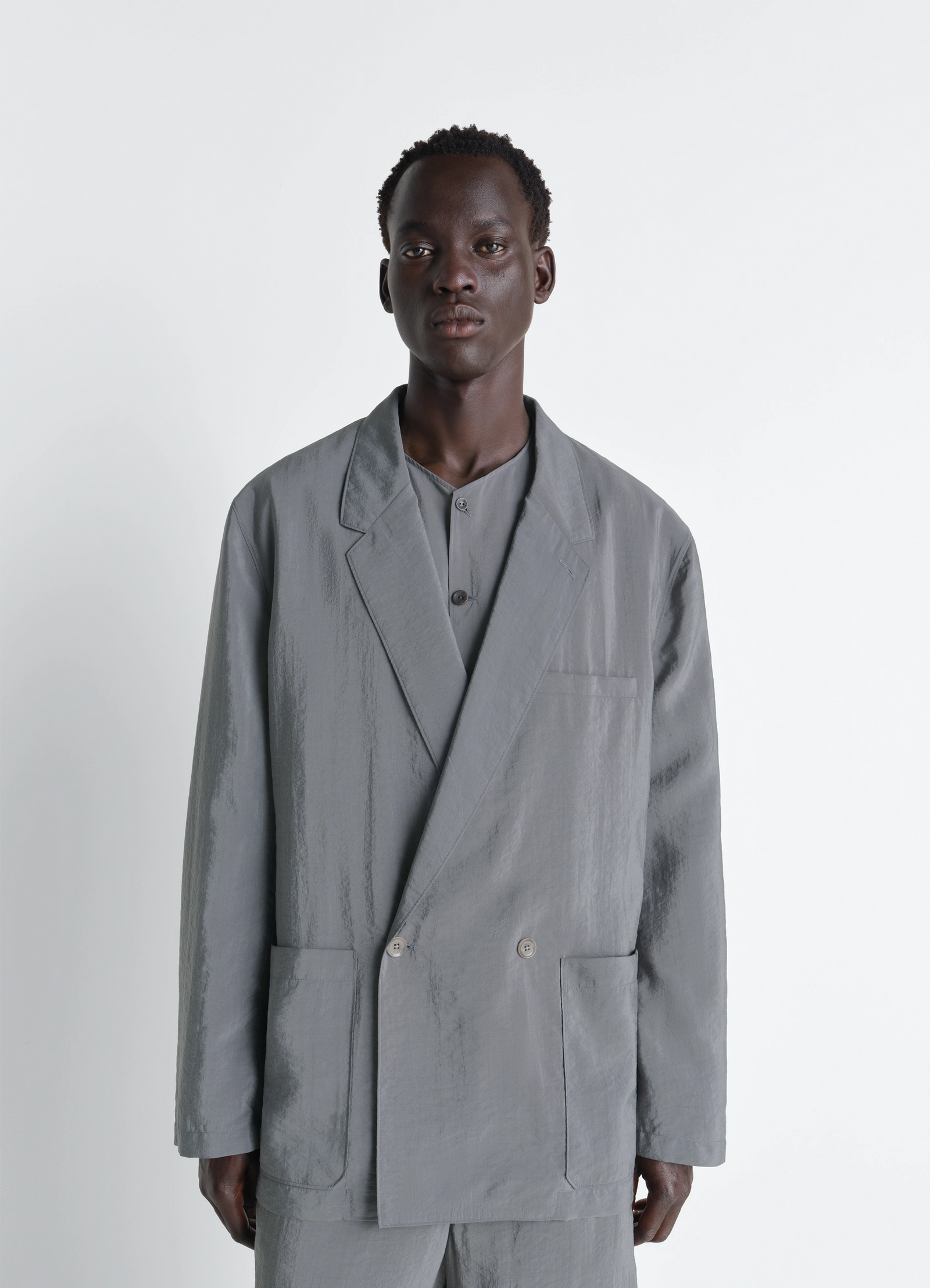 Soft double breasted jacket in dry silk, model shot, front view tailored, modern silhouette