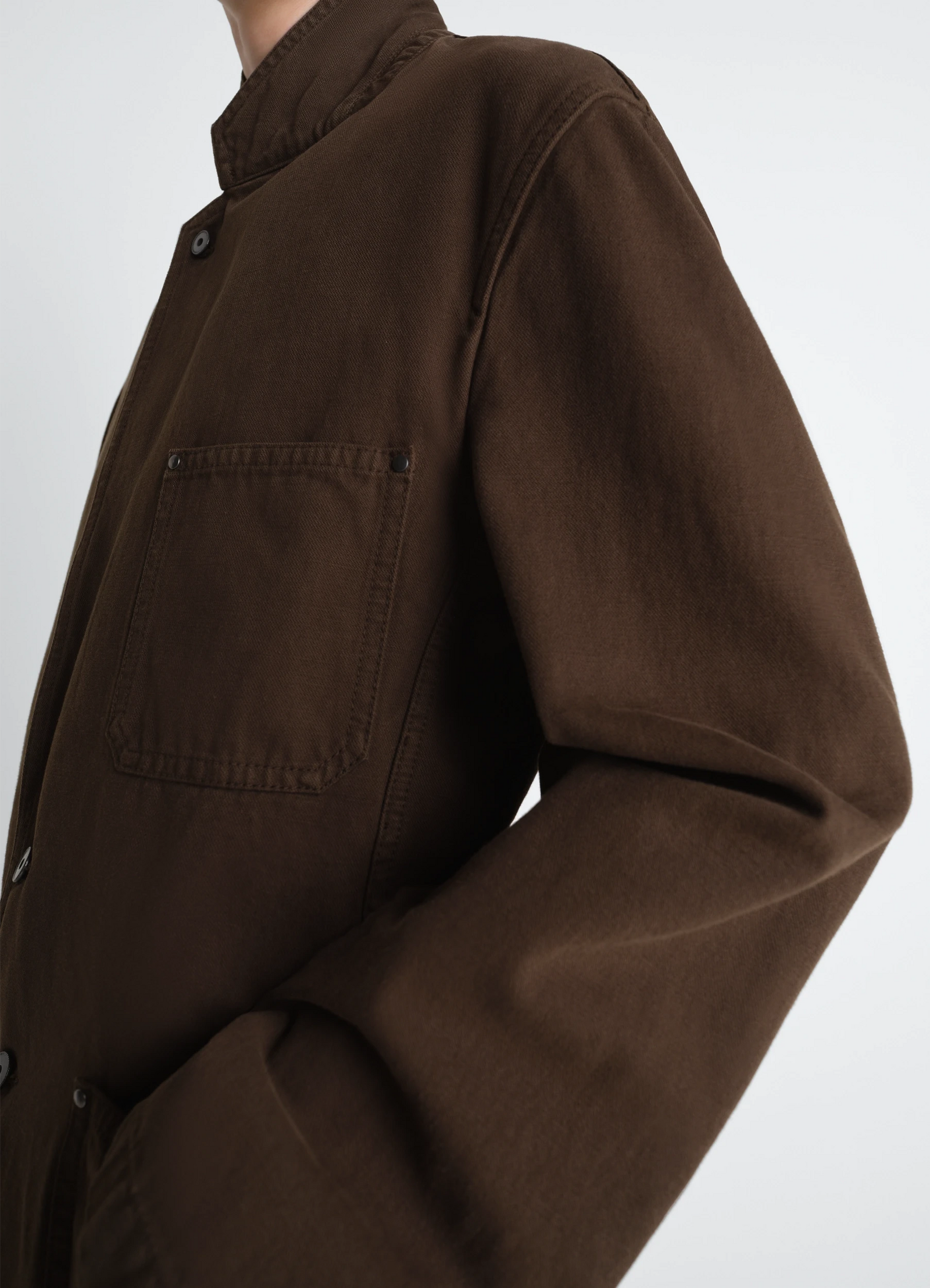 Single breasted tailored jacket in dyed heavy broken twill, model shot, side detail view chest pocket detail