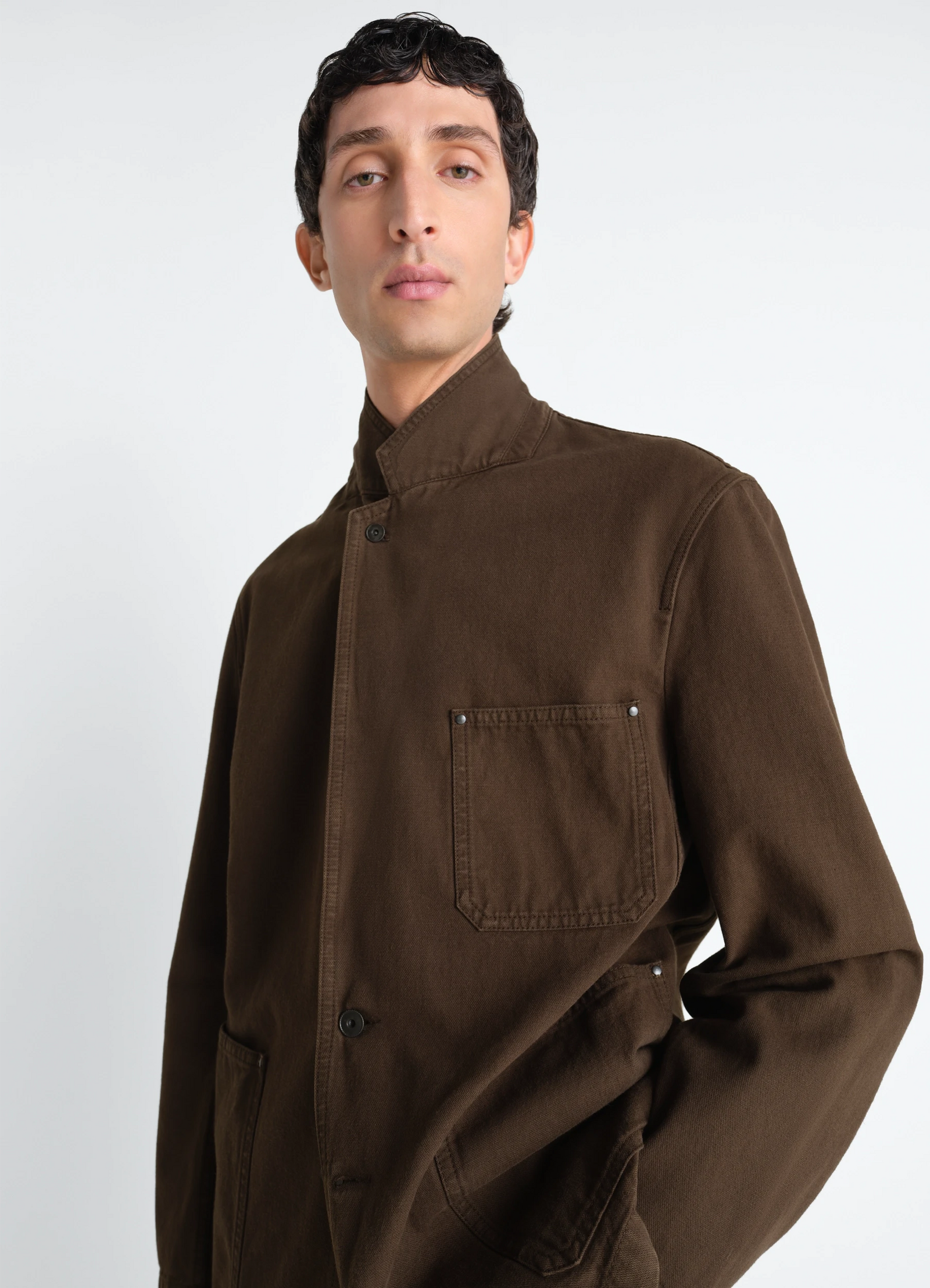 Single breasted tailored jacket in dyed heavy broken twill, model shot, close-up front view high collar, chest pocket