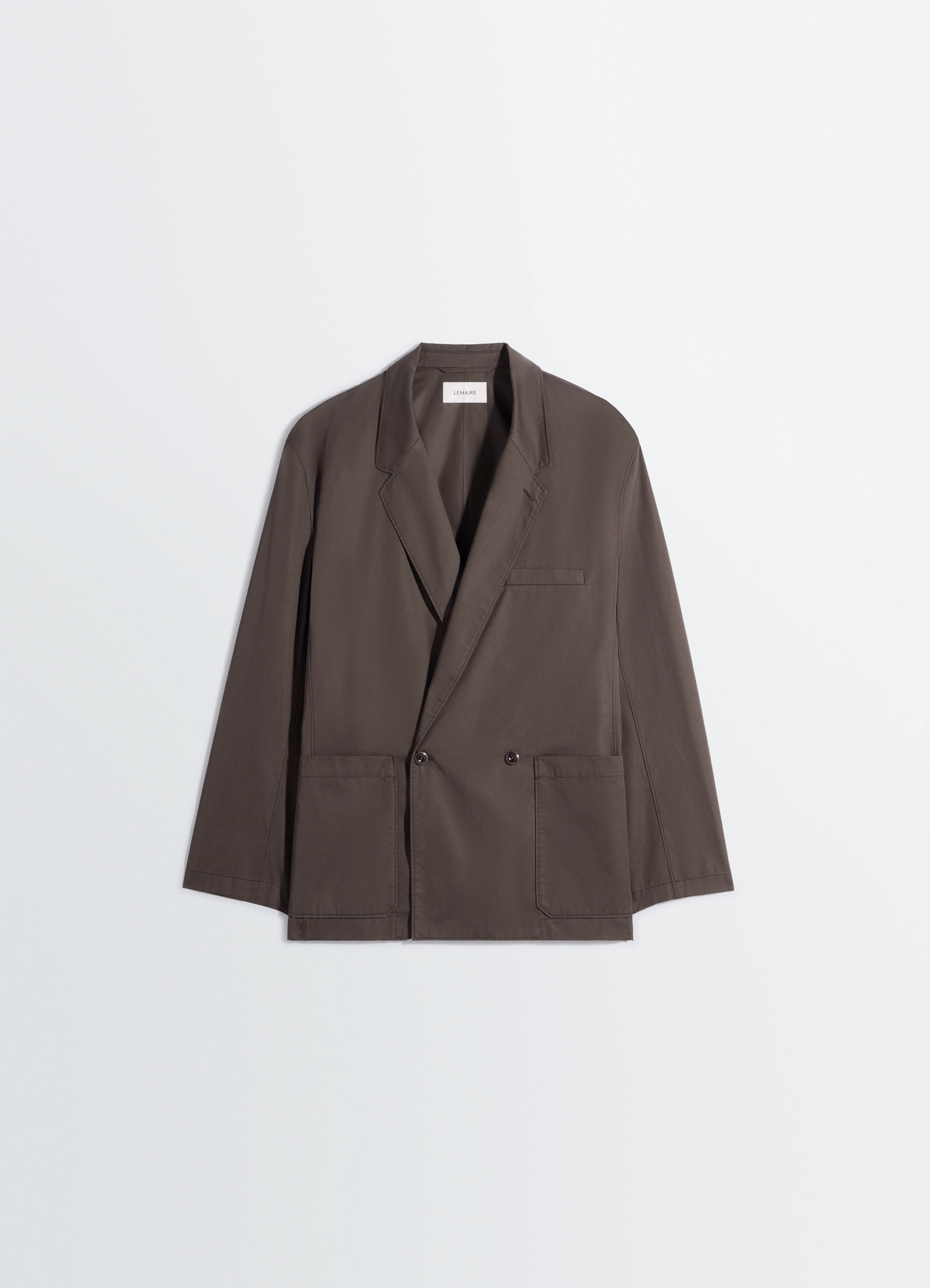Double breasted workwear jacket in cotton twill, product shot, angled overhead shot notched lapel, front buttons