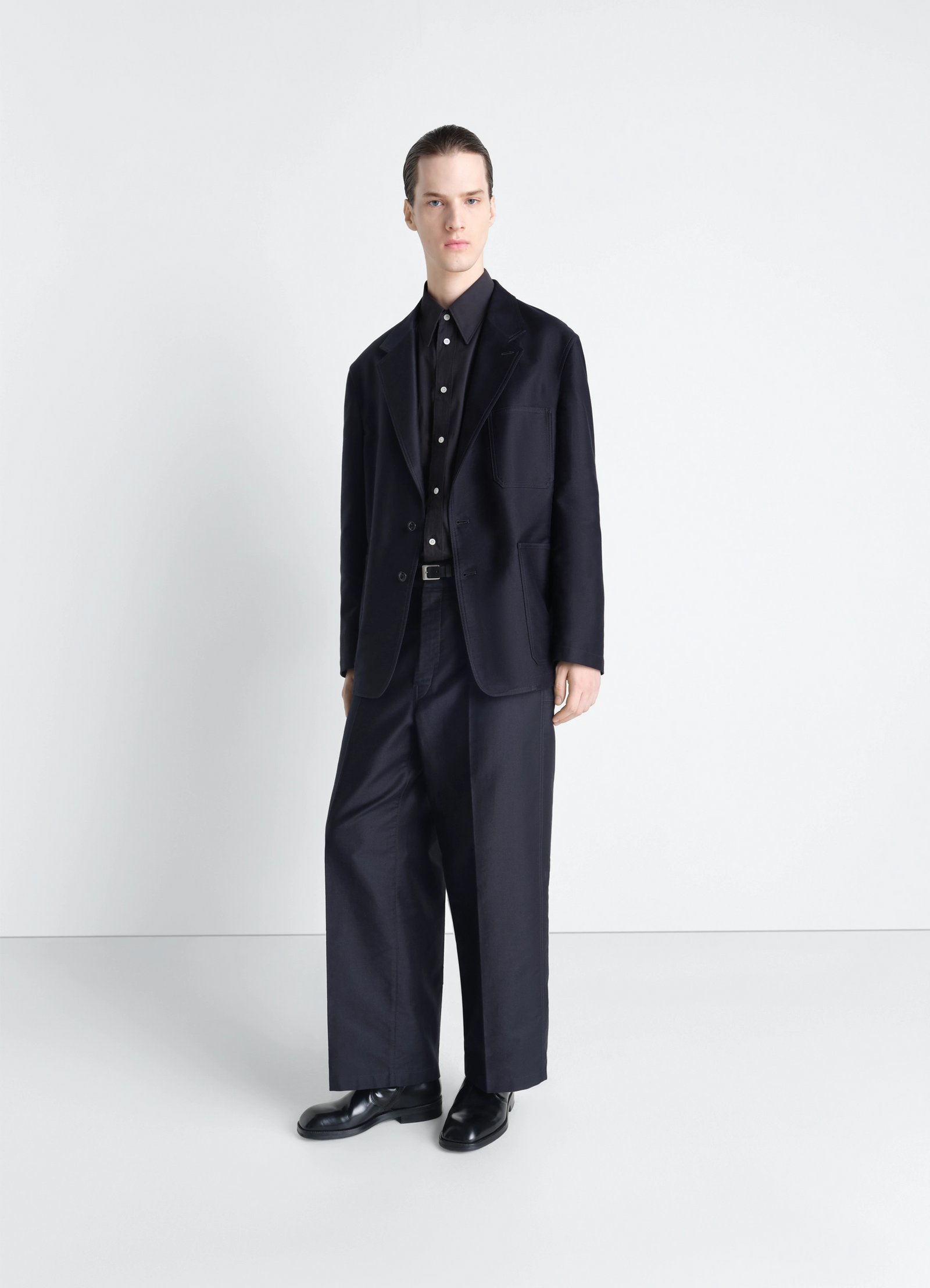 Single breasted workwear jacket in cotton satin, model shot, three-quarter view straight cut