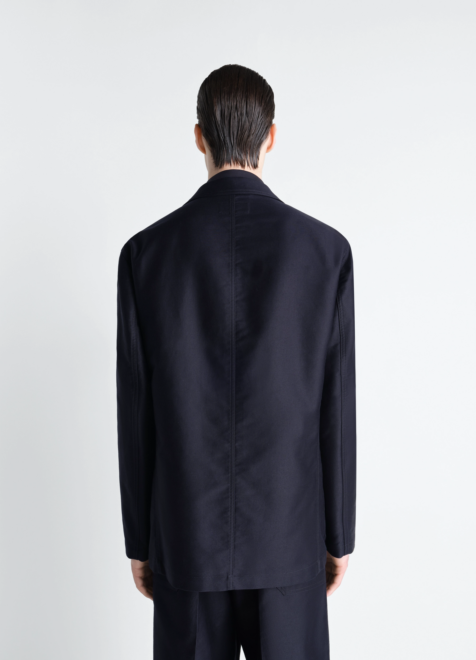Single breasted workwear jacket in cotton satin, model shot, back view seam detail