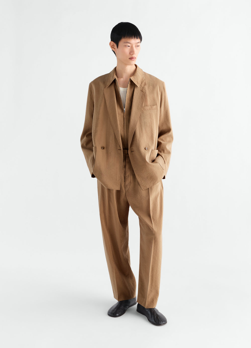 Light brown dry silk double-breasted jacket and trousers worn by model LEMAIRE front view