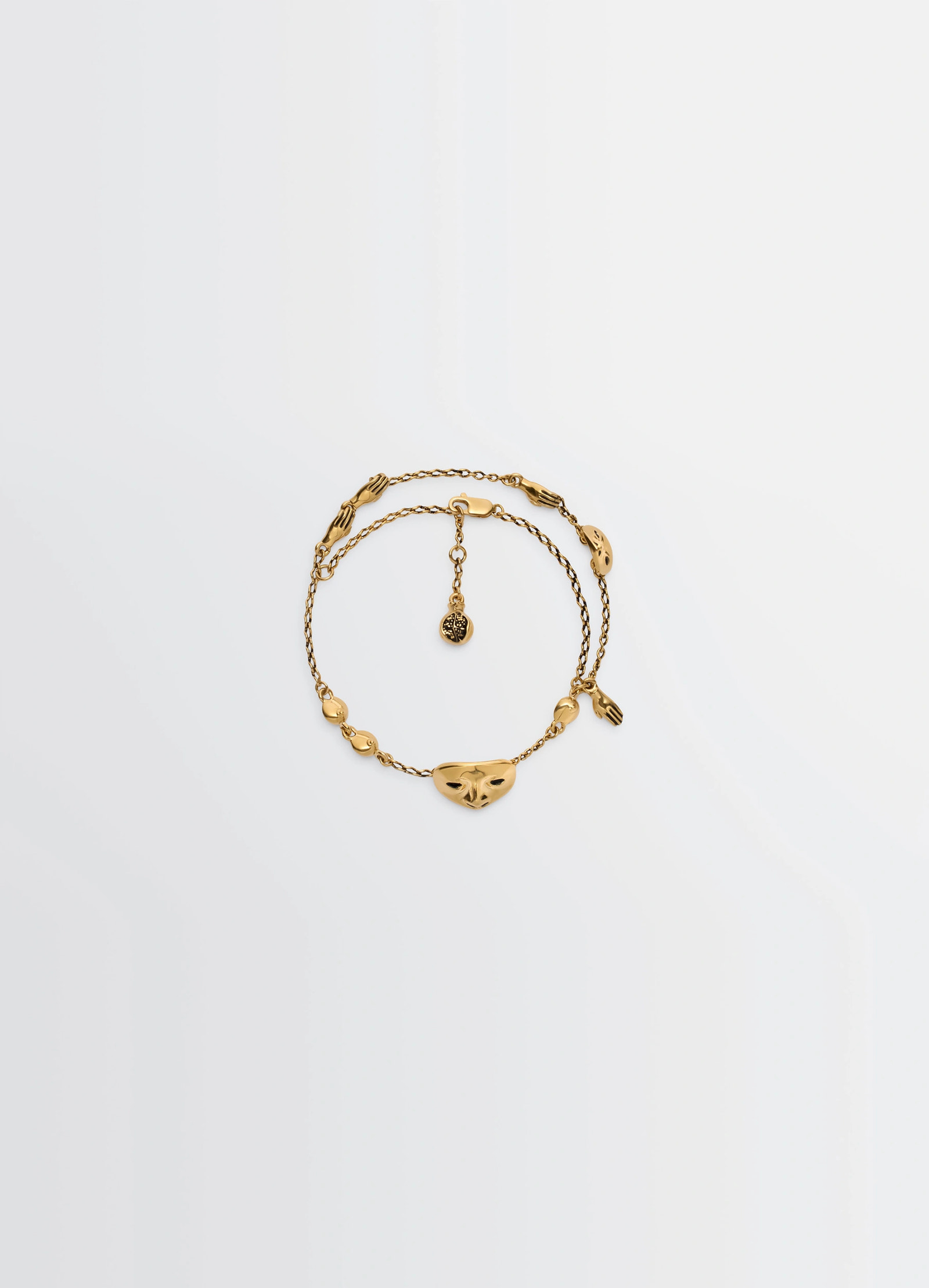 Estampe bracelet in aged-effect gold-plated brass, product shot, top view delicate figurative forms
