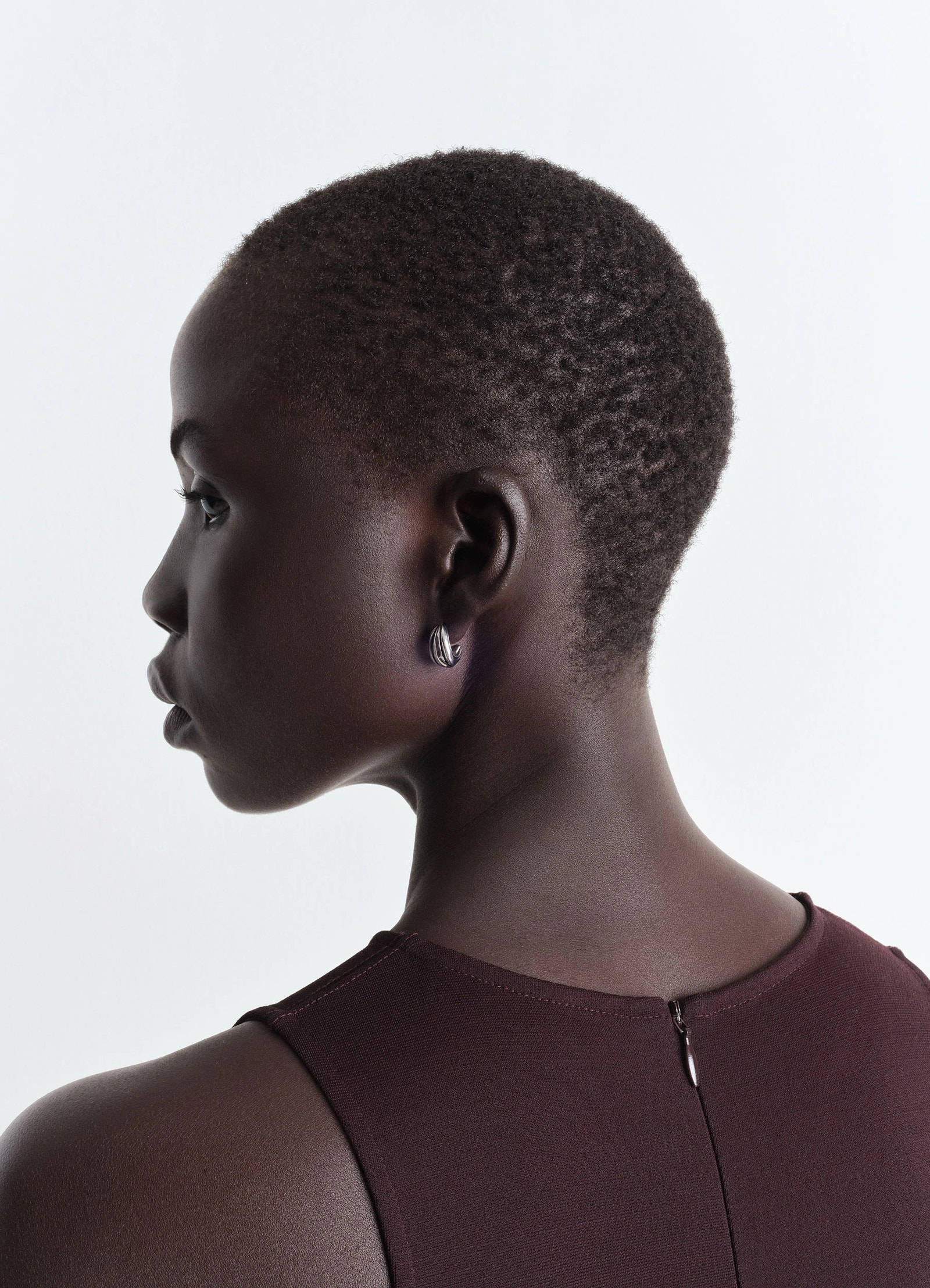 Girasol earrings in silver-plated brass, model shot, side view smooth finish