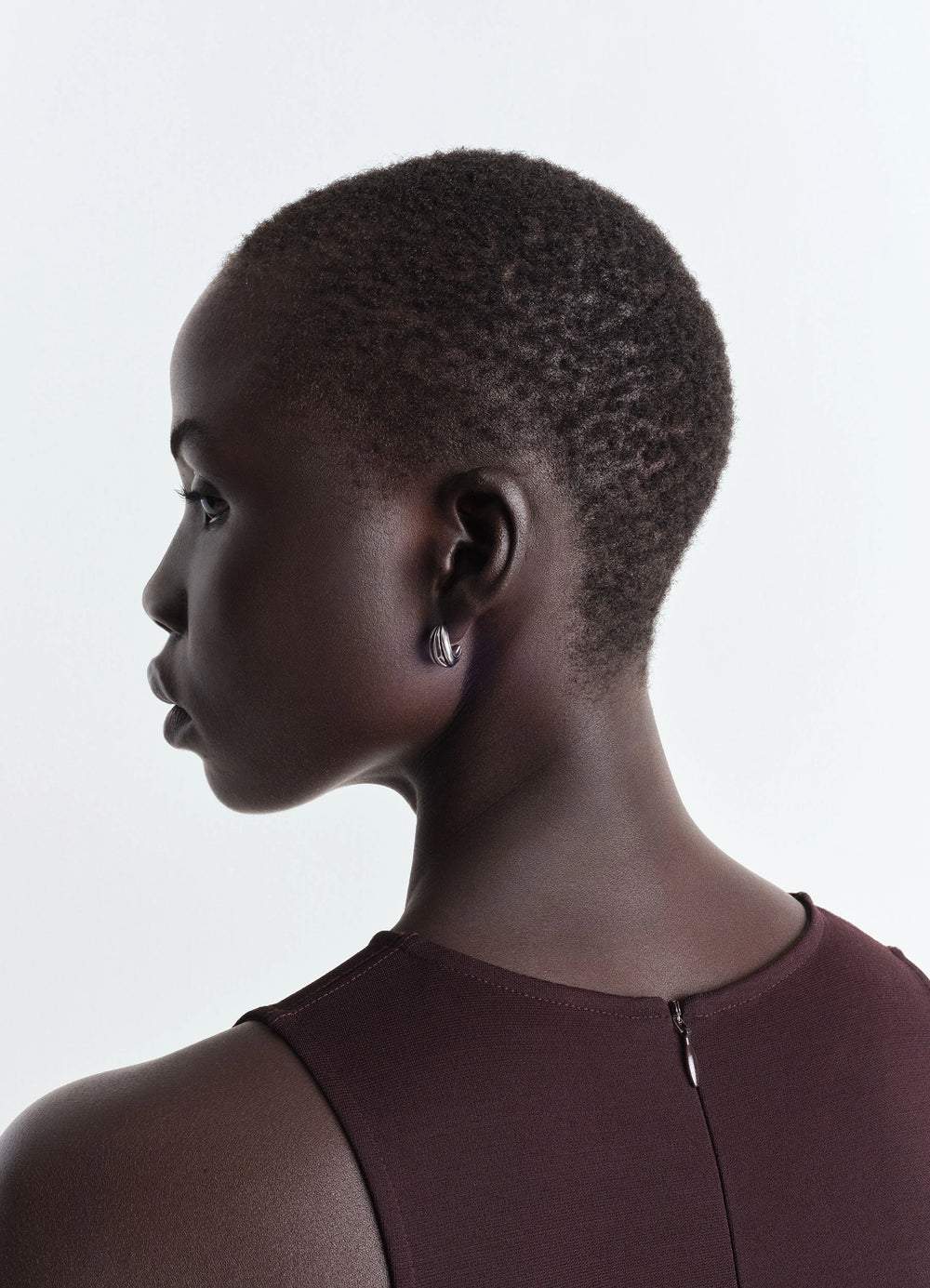 Girasol Earrings in Silver-plated Brass, model shot, side view smooth finish