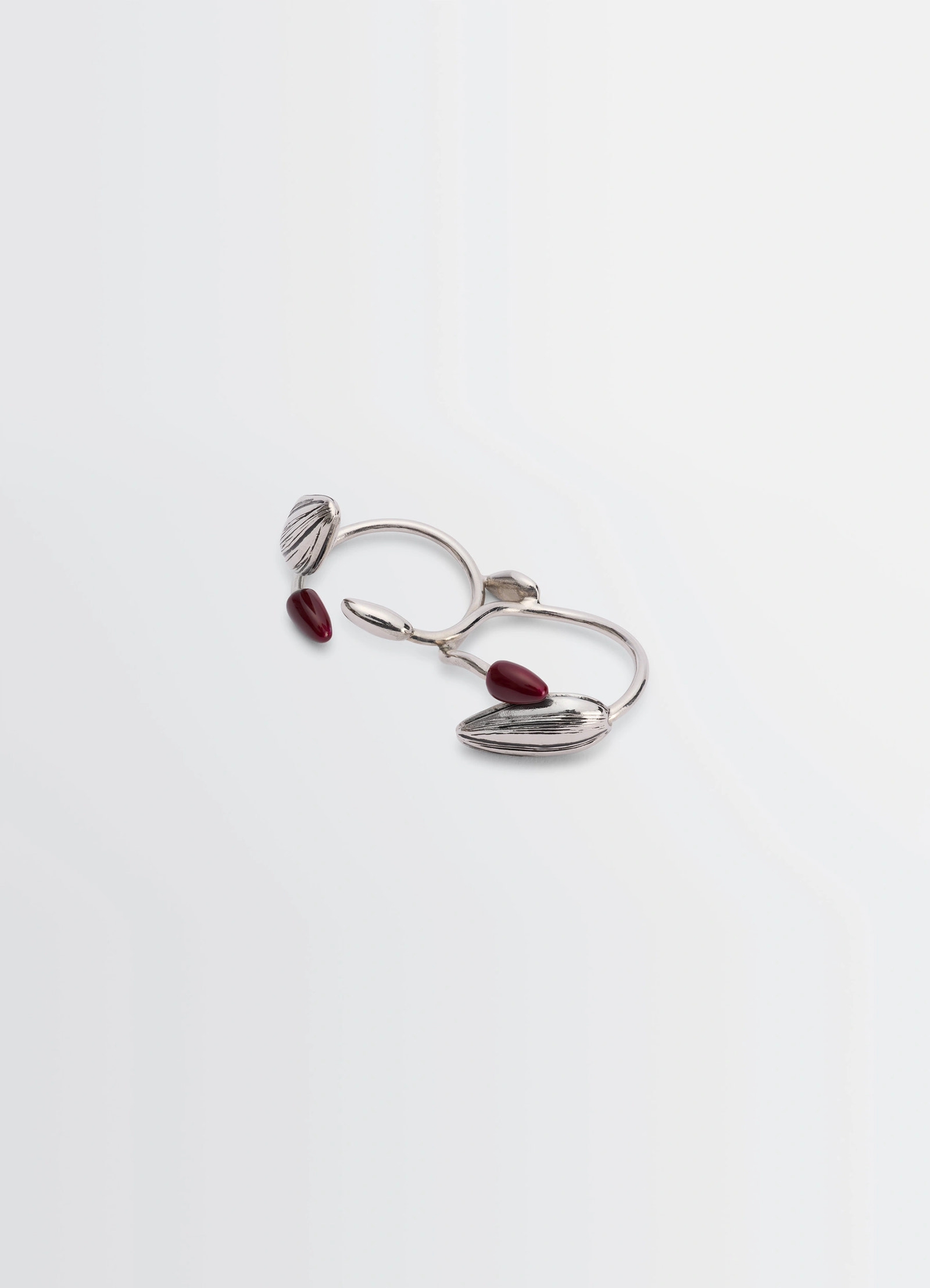 Girasol double ring in silver-plated brass with resin, product shot, angled top view asymmetrical artistic