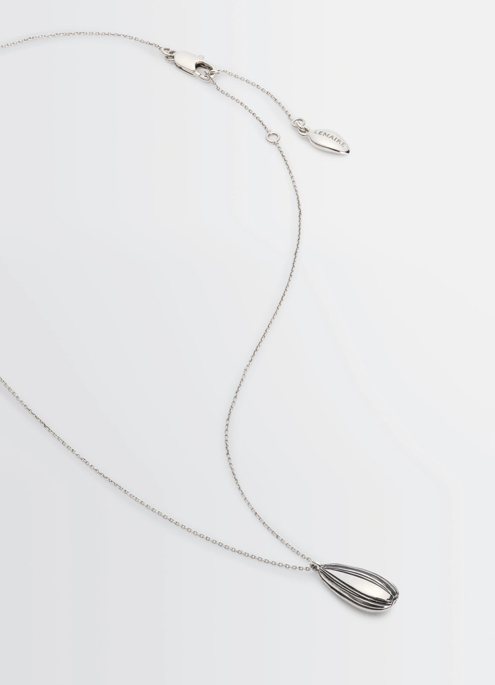 Girasol Necklace in Silver-plated brass, product shot, angled top view pendant with clasp detail