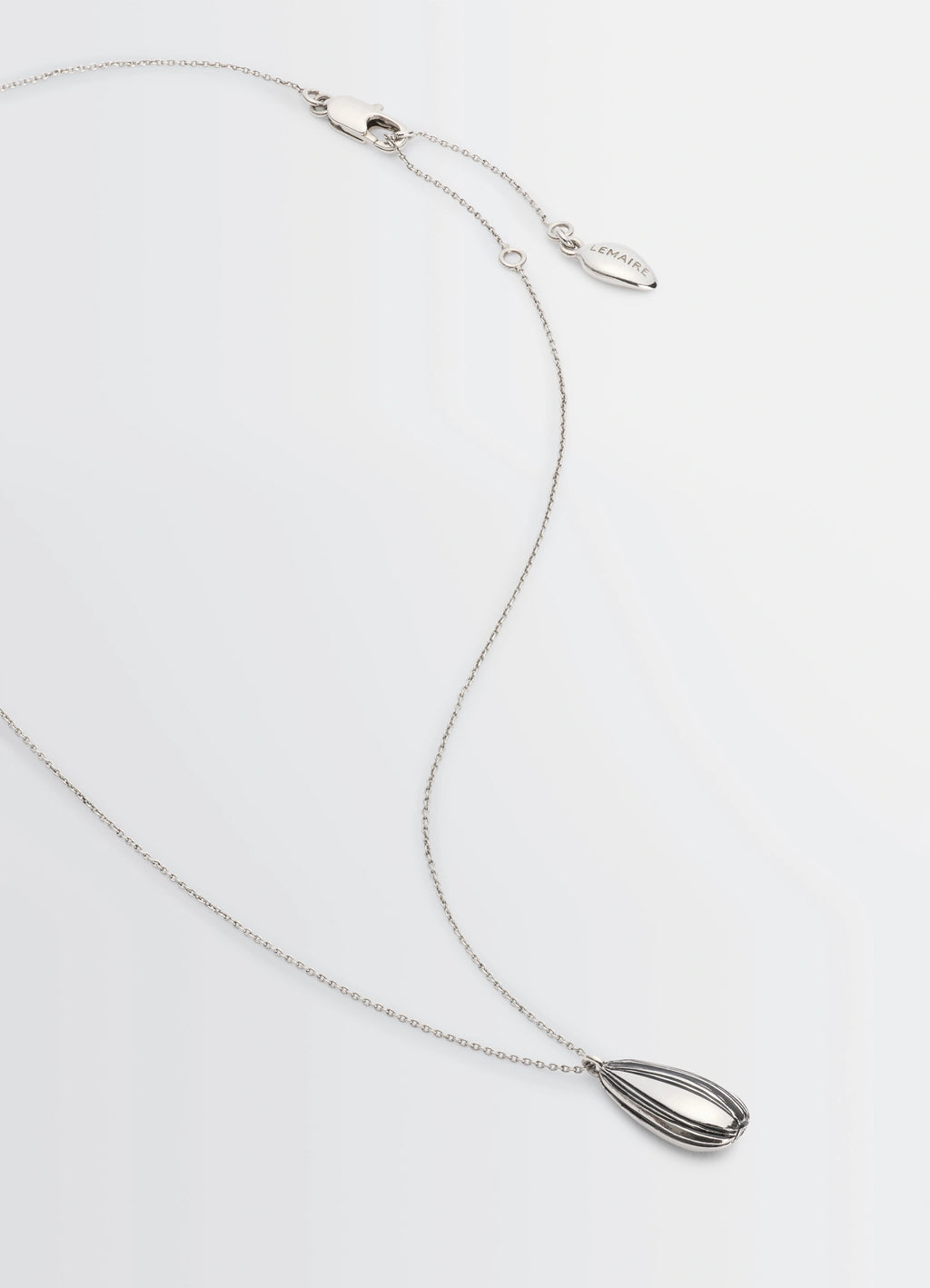 Girasol Necklace in Silver-plated brass, product shot, angled top view pendant with clasp detail