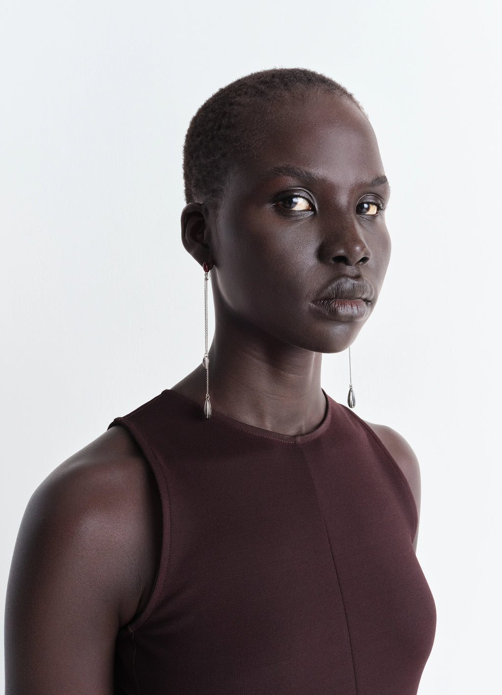 Asymmetric Girasol Earrings in Silver-plated brass, model shot, side profile view long minimal chain