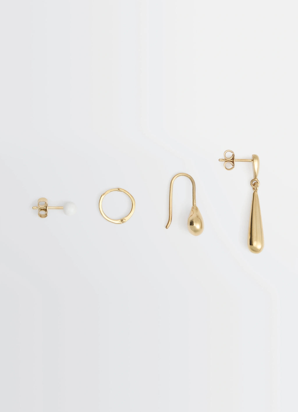 PIERCINGS SET in Gold-plated silver and resin, product shot, Top view Various Lemaire inspired shapes