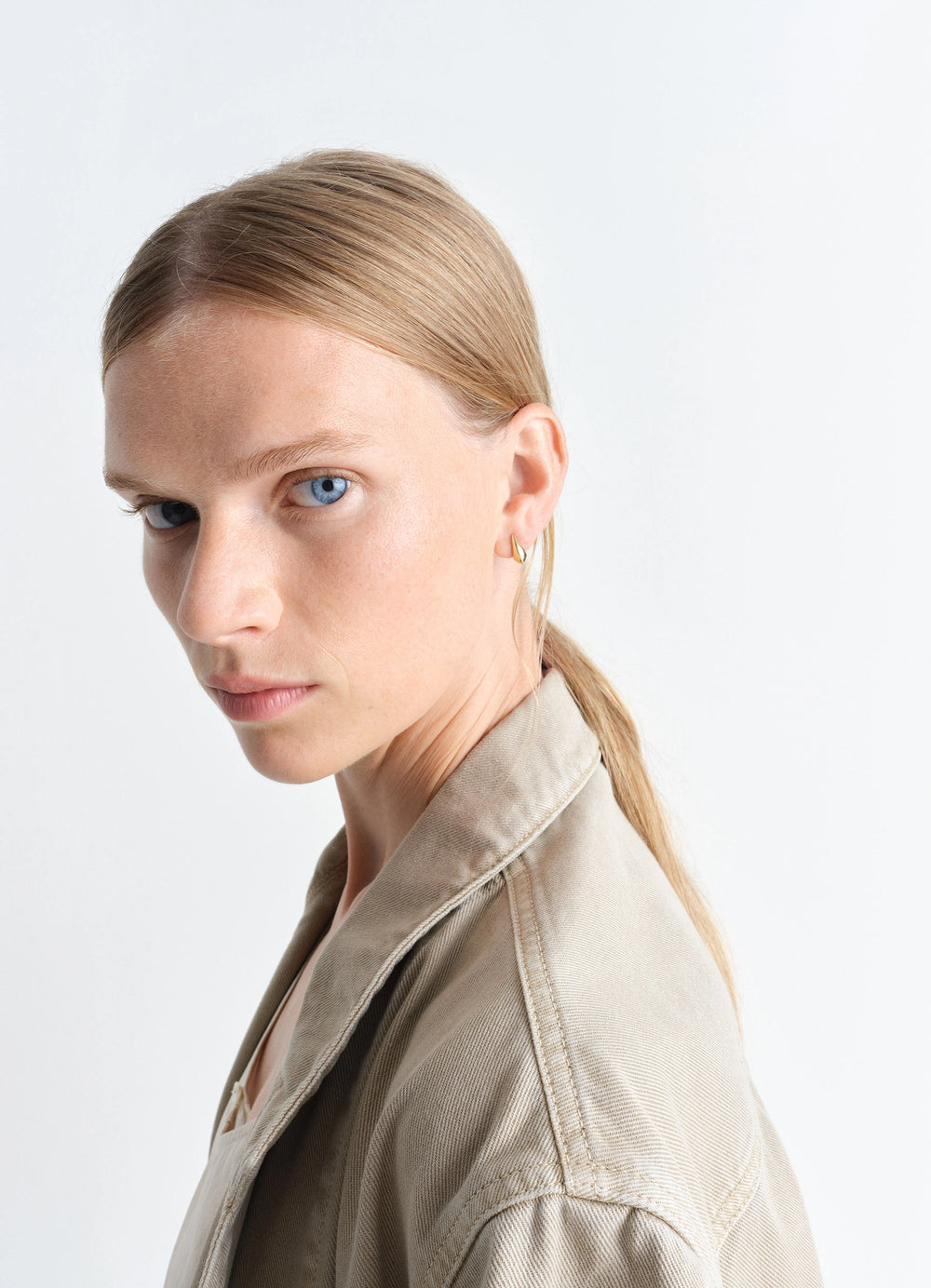 Lemaire Micro Drop Earrings in Vermeil, model shot, side detail view minimal gold finish