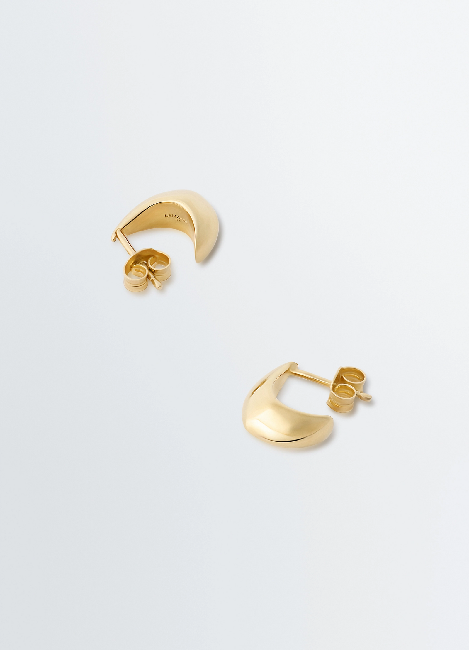 Micro drop earrings in vermeil in vermeil, product shot, overhead view curved surface design
