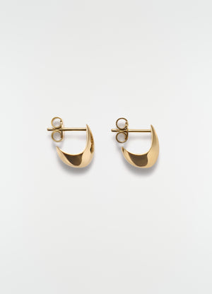 Micro drop gold-toned metal earrings by lemaire on plain white background, front view close-up
