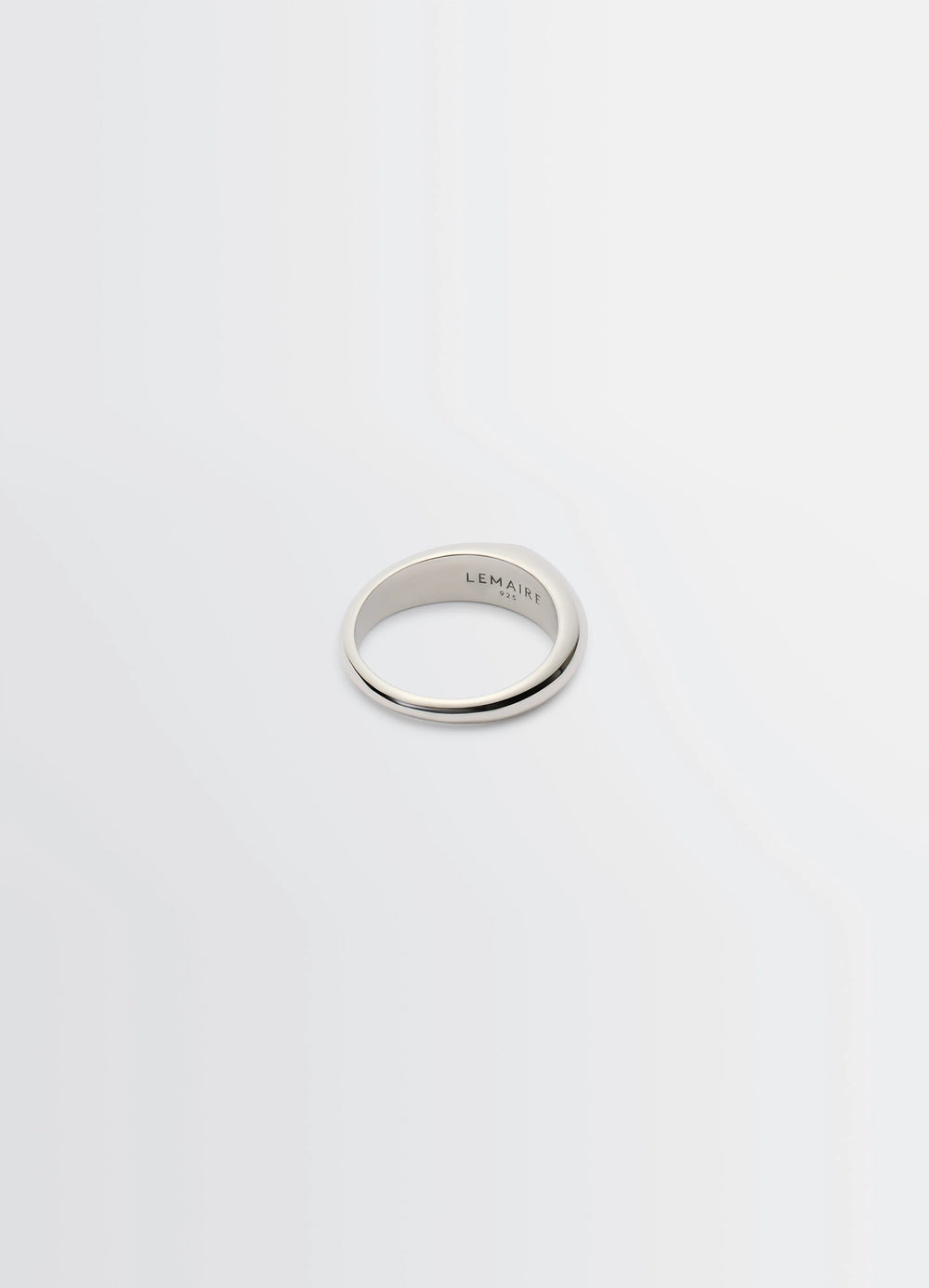 Lemaire Drop Ring in Rhodium-plated Silver, product shot, three-quarter view engraved interior lettering